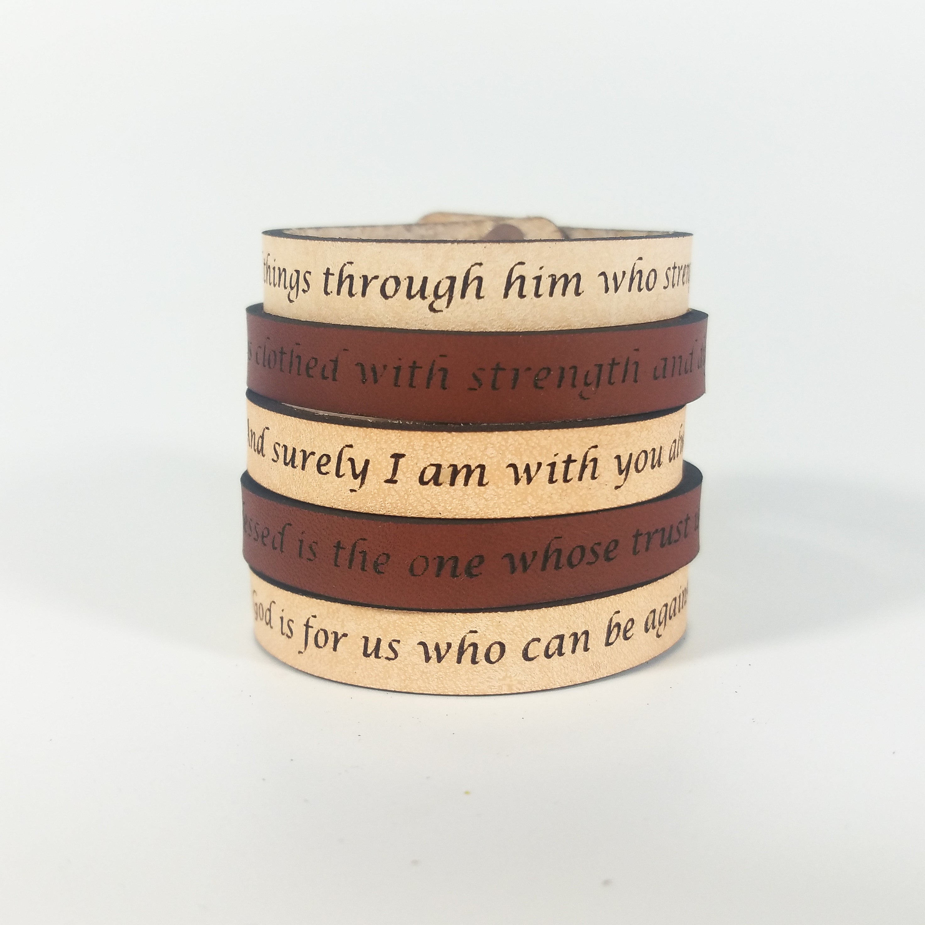 The Spiritual Quote Bracelet made of genuine leather features an adjustable button closure and is inscribed with the message: "If God is for us, who can be against us.