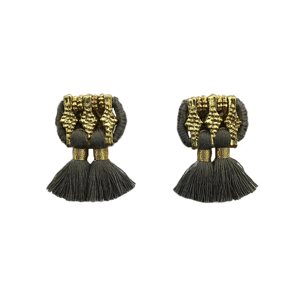 A pair of Jhumka Earrings in gold and black, showcasing detailed geometric designs with fringed ends.