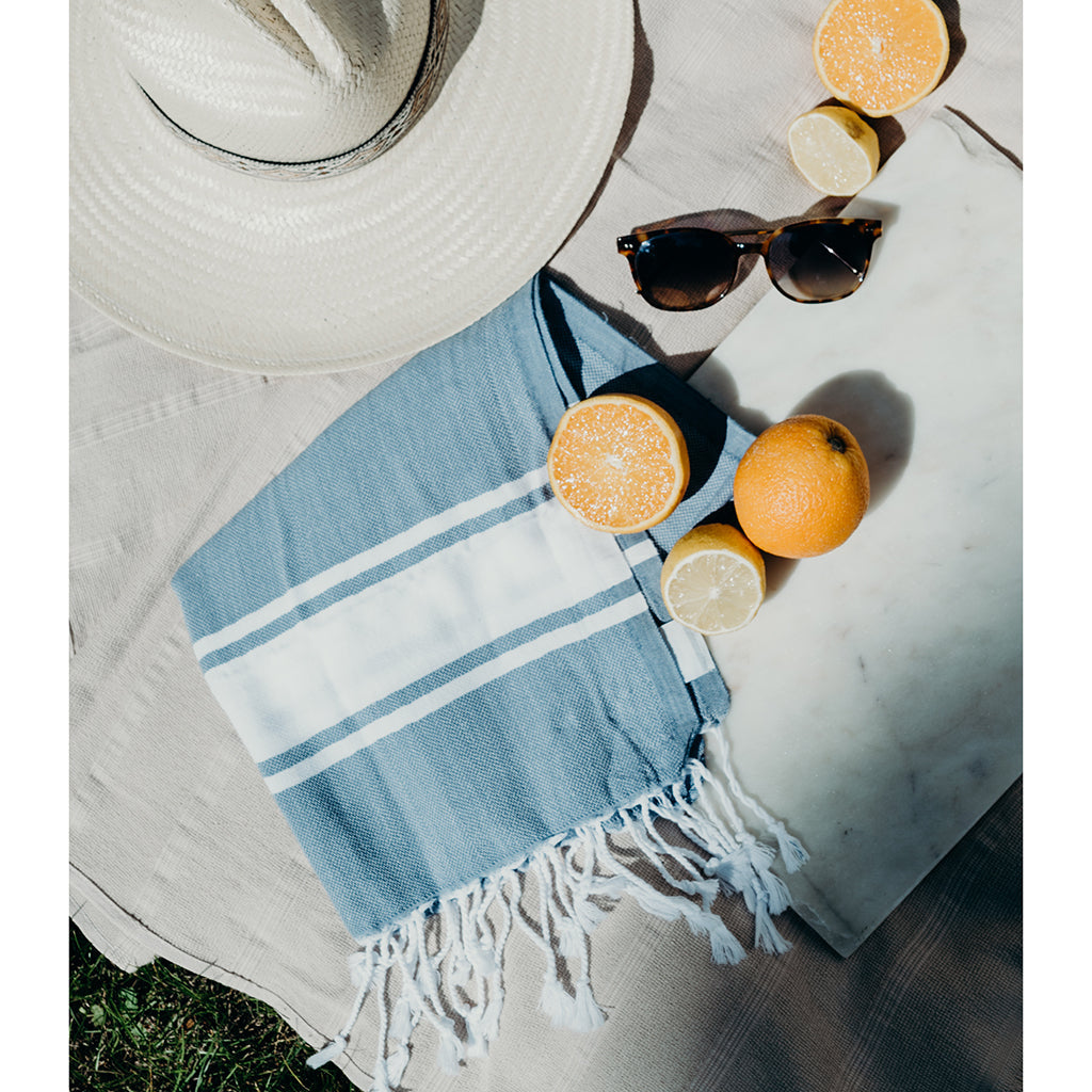 Introducing the Essential Stripe Turkish Hand Towel: crafted from 100% Turkish cotton, this towel combines gray and white stripes with fringed edges and exceptional absorbency.