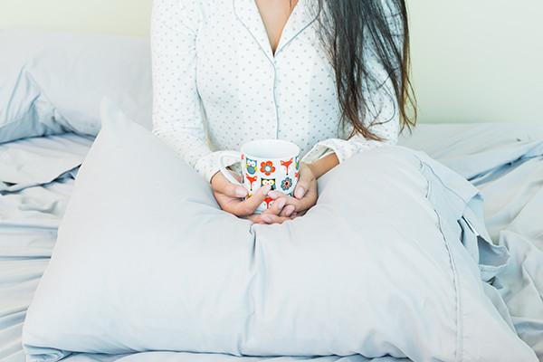 A stack of White microfiber sheets providing luxurious comfort.