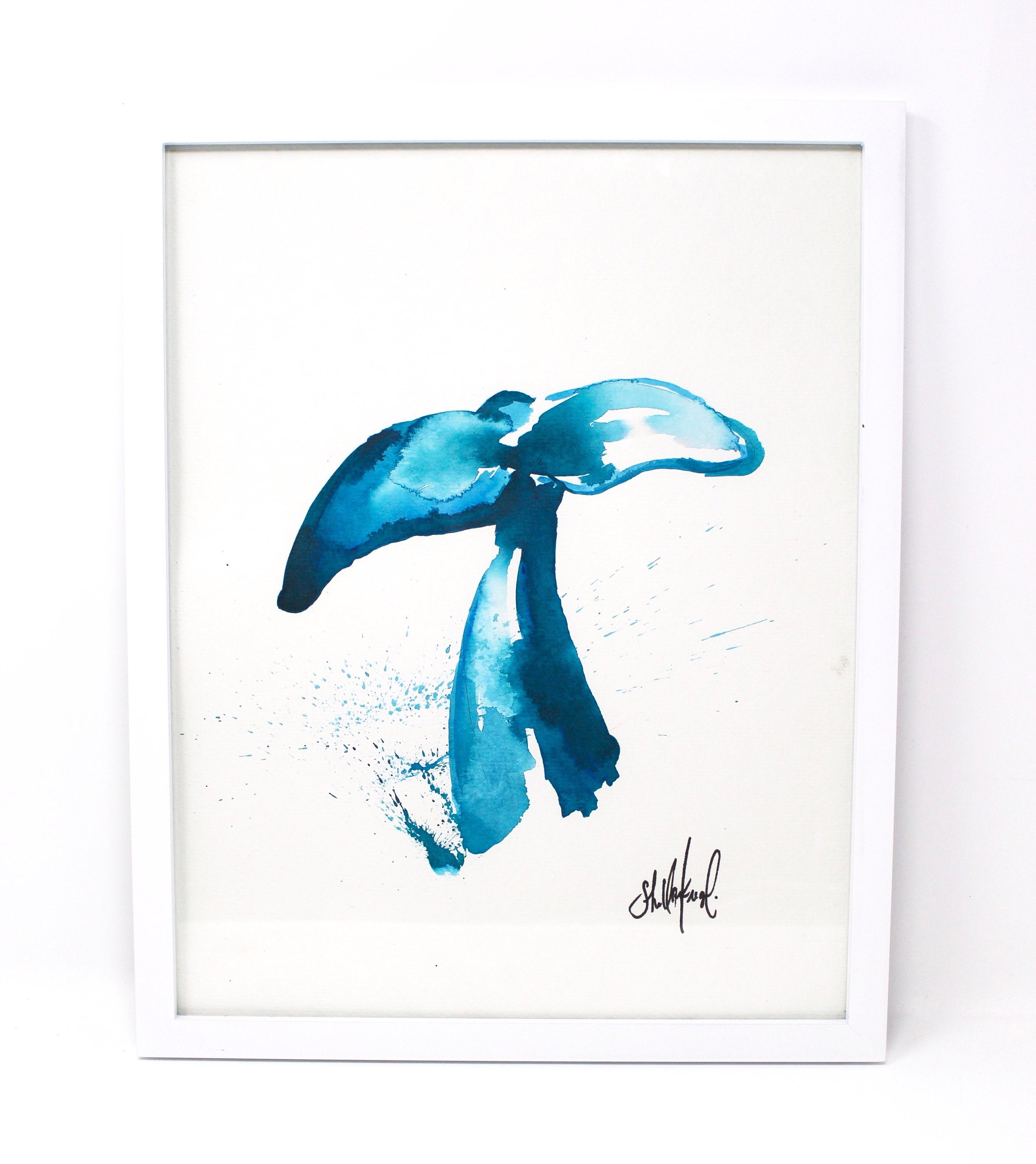 This Whale Art Print, titled "Whale Tail," measures 11x14 inches and features a coastal abstract design in shades of blue, reminiscent of a flowing whale tail. It comes framed in white with an artist's signature at the lower right corner. Ideal for a gallery wall, its tranquil tones capture the serene beauty of Southern California.