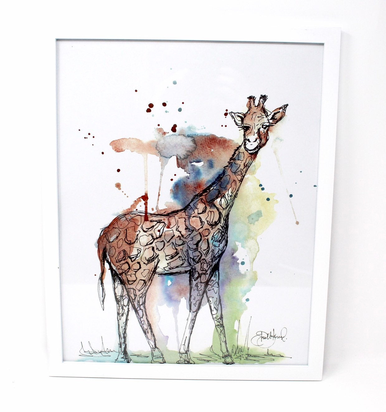 The Mixed Media Giraffe Art Print - 11x14in offers a captivating watercolor illustration of a giraffe set against a backdrop of blue, green, and brown splashes, making it a delightful addition to any nursery decor.