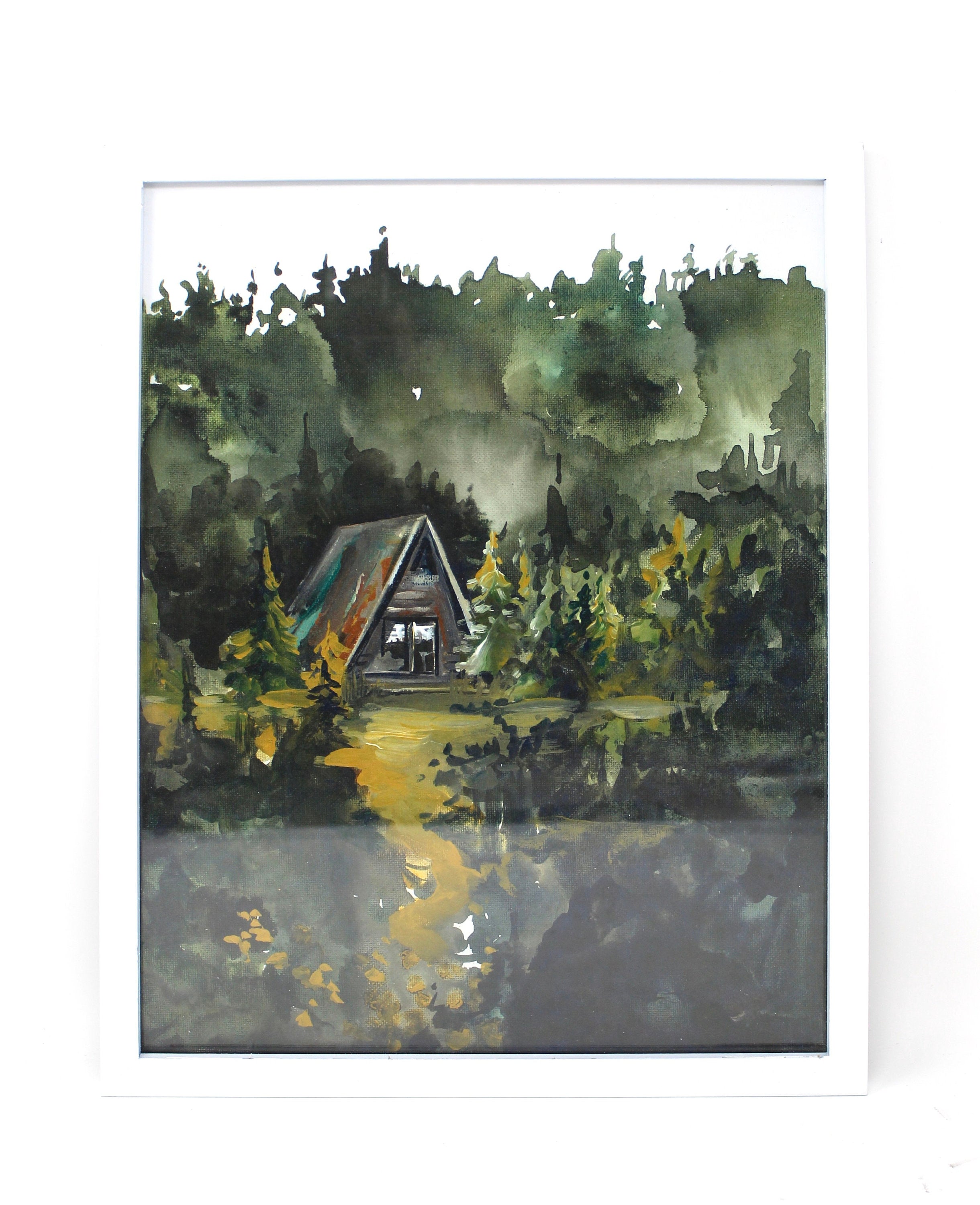 The Cozy Cabin Print 11x14 Adventure Print captures the allure of a watercolor painting portraying a cabin nestled in a dense, dark forest with an inviting path. This piece of home decor is perfect for adventure lovers and inspires mystery and the promise of discovery as inspirational wall art.