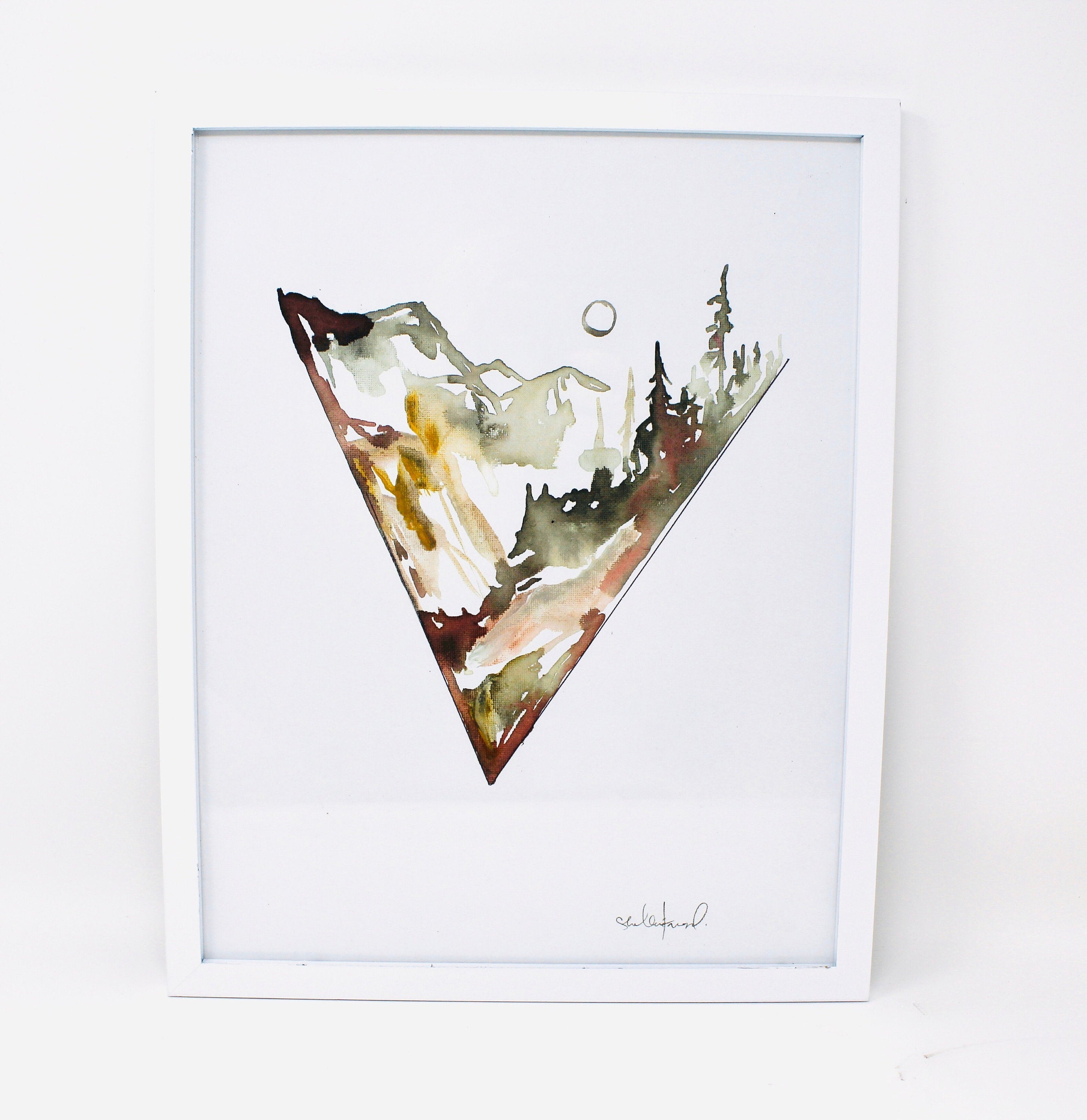 This Minimal Triangle Mountain Watercolor 11x14 Art Print, showcasing an elegant mountain landscape within an inverted triangle design, is perfect for adding a touch of adventure to a simple gallery wall.