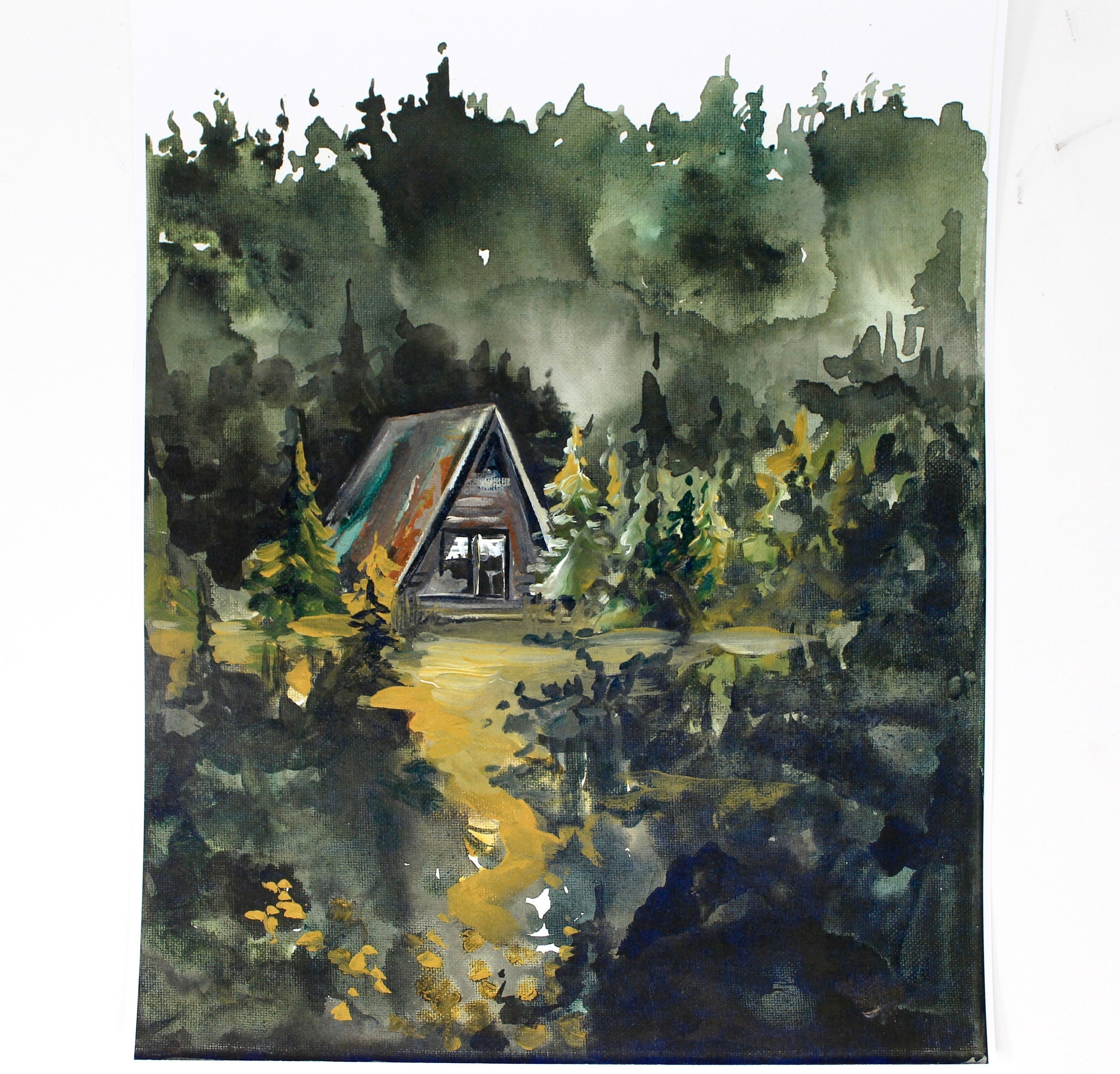 The Cozy Cabin Print 11x14 Adventure Print captures the allure of a watercolor painting portraying a cabin nestled in a dense, dark forest with an inviting path. This piece of home decor is perfect for adventure lovers and inspires mystery and the promise of discovery as inspirational wall art.