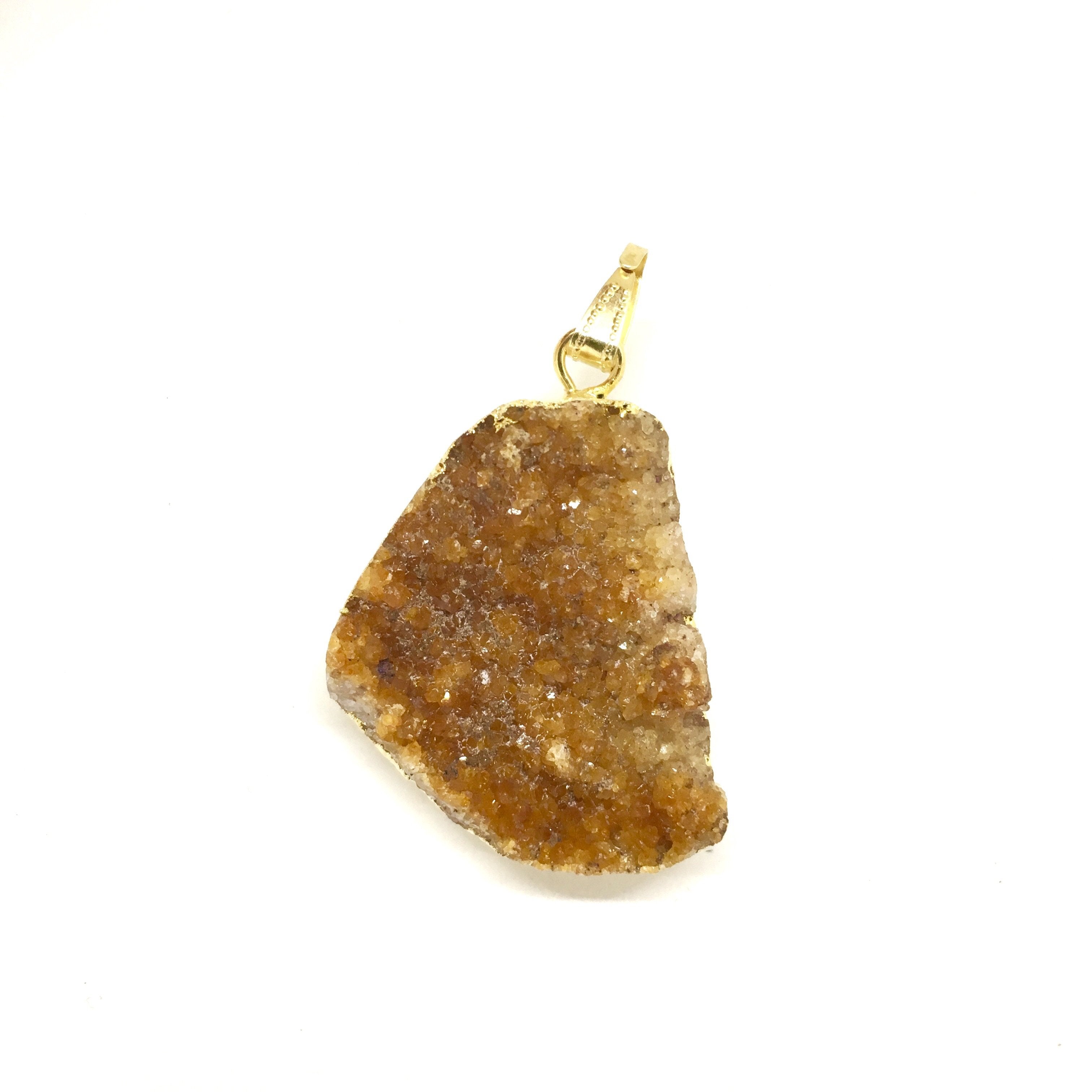 A triangular Orange Citrine Cluster Pendant with a gold clasp, displayed on a white background.