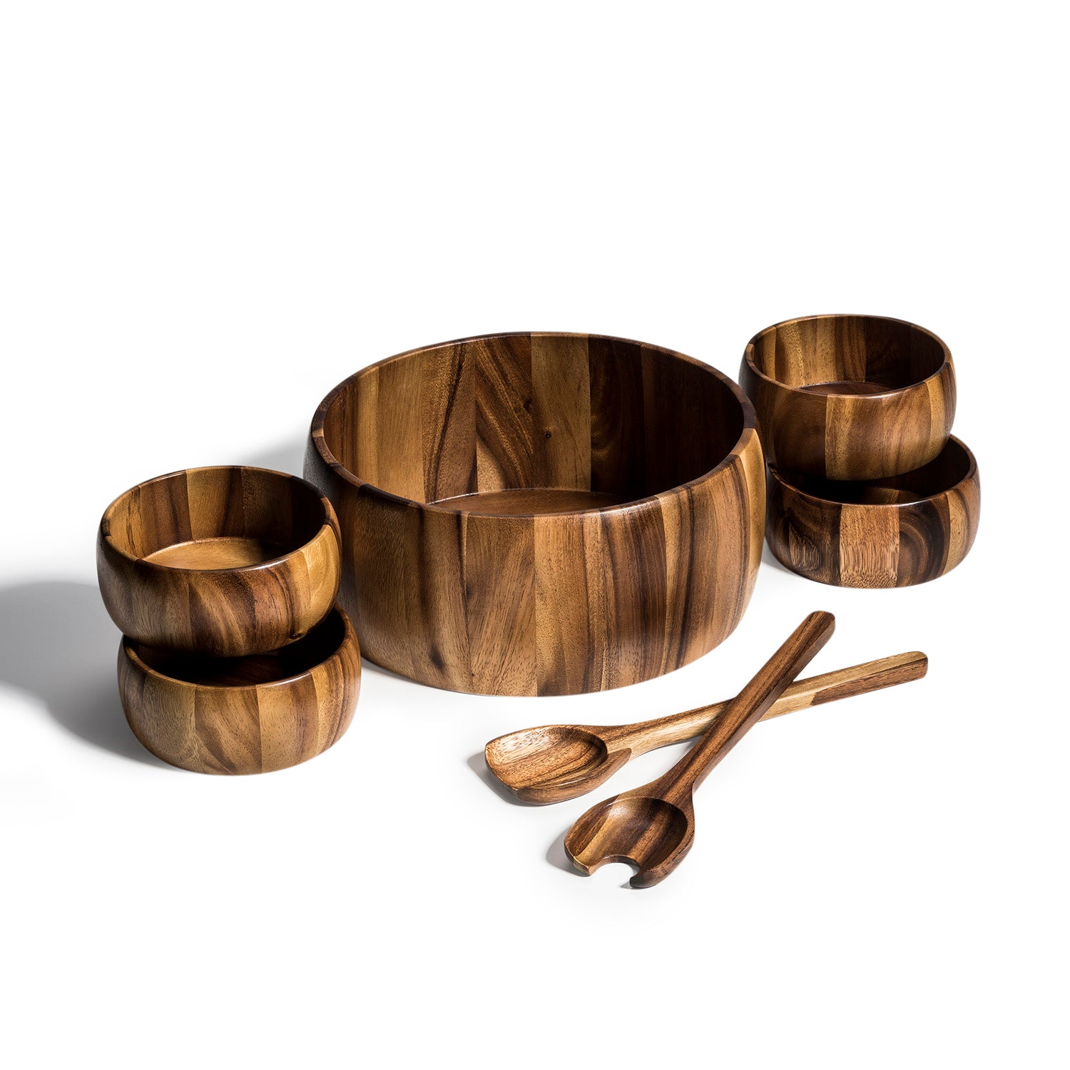 This Dragor 7-piece set features an extra large Acacia wood salad bowl, complemented by four charming individual bowls and two elegant serving utensils, beautifully arranged on a white background—making it the perfect hostess gift.