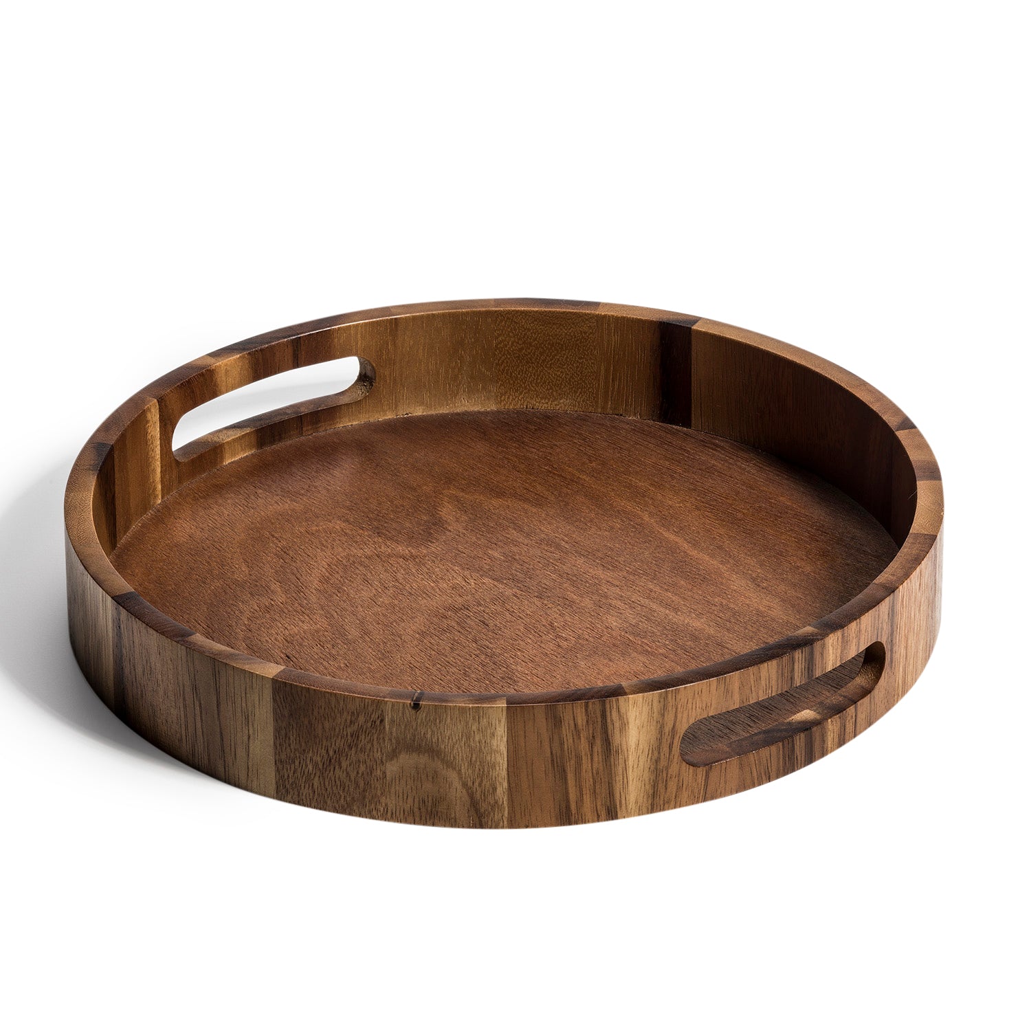 The Aalborg Round Serving Tray is crafted from environmentally friendly Acacia wood and features two handle cutouts on the sides.