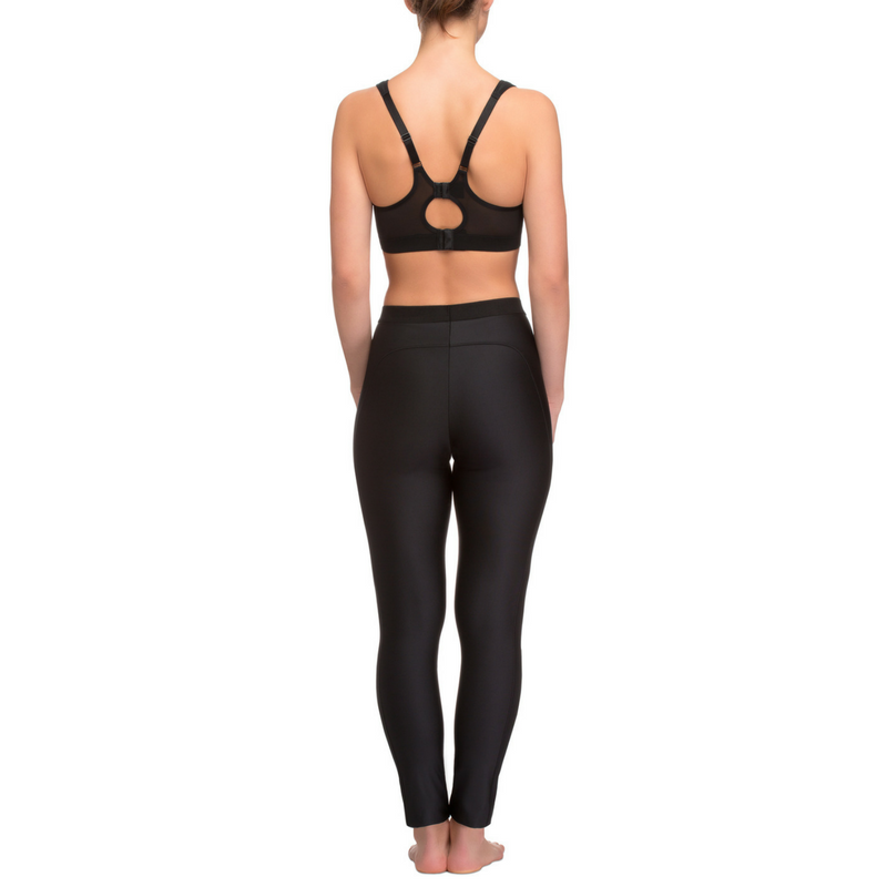 A person standing on a plain white background, wearing Long Fitness Leggings Lauma Active Lady Fitness in black, made from elastic fabric. The person is barefoot with their feet close together. Only the lower part of the body is visible, ideal for average intensity workouts.