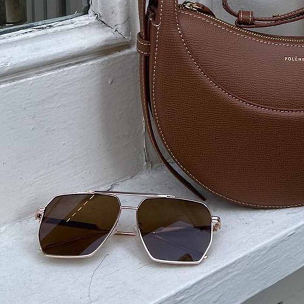 A pair of Goldie sunglasses with brown lenses.