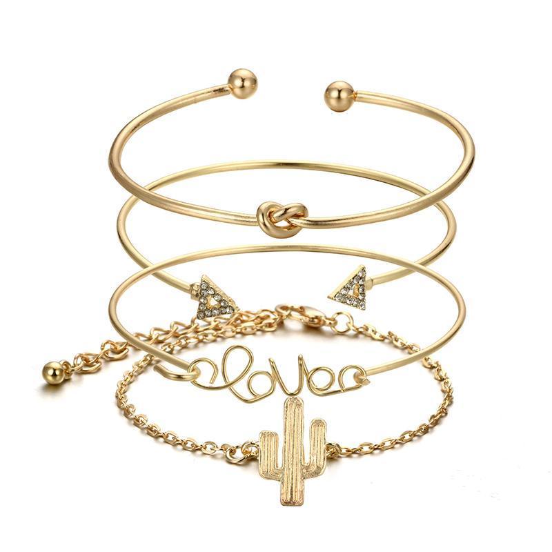 A woman's wrist adorned with three Love Bracelet Stacks.
