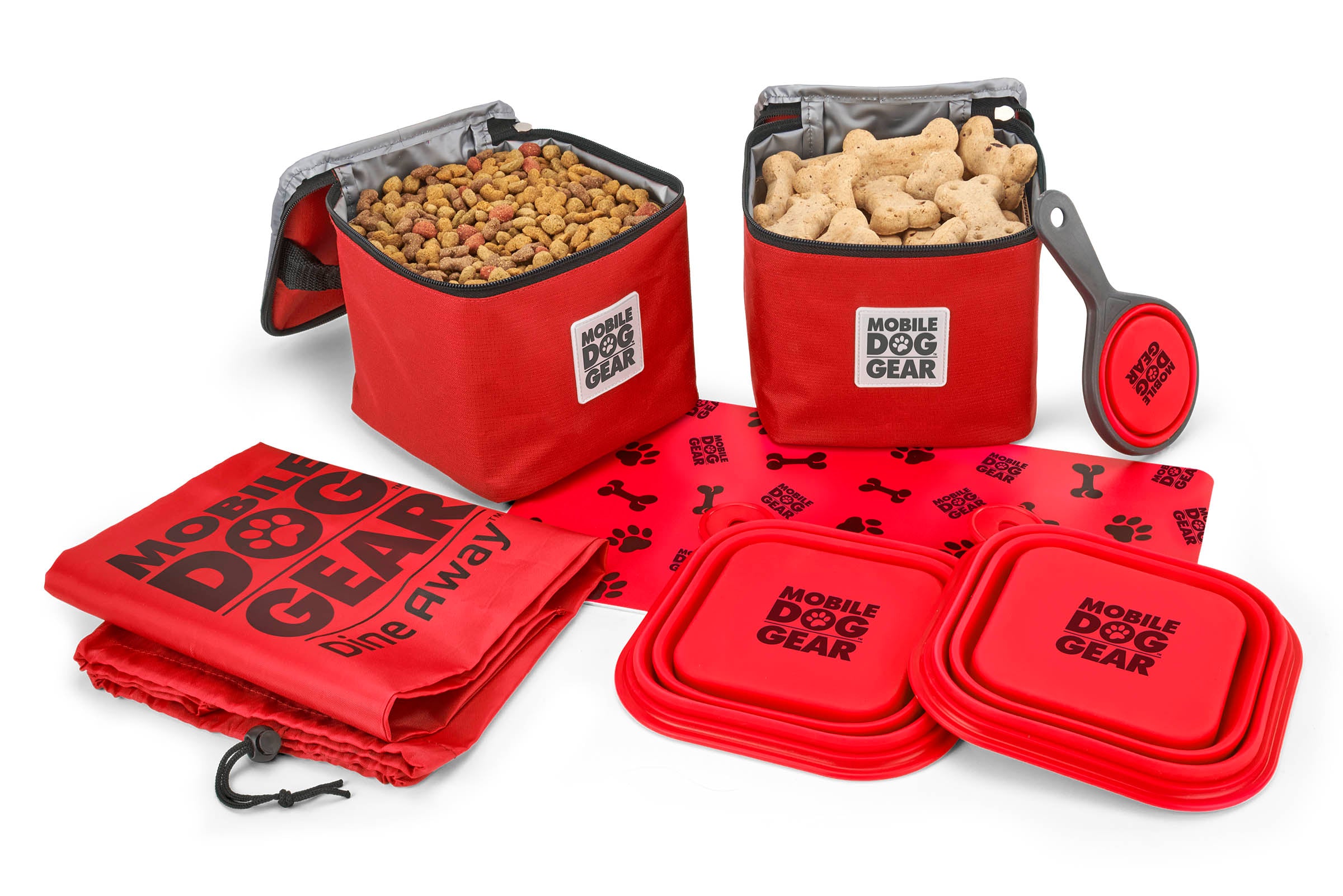 The Dine Away Bag (Med/Lg Dogs)™ features food containers, collapsible bowls, a food scoop, a placemat, and a carrying bag. A dog's photo in a speech bubble declares, "This is my gear!" It's perfectly designed for your adventurous pup's pet luggage.