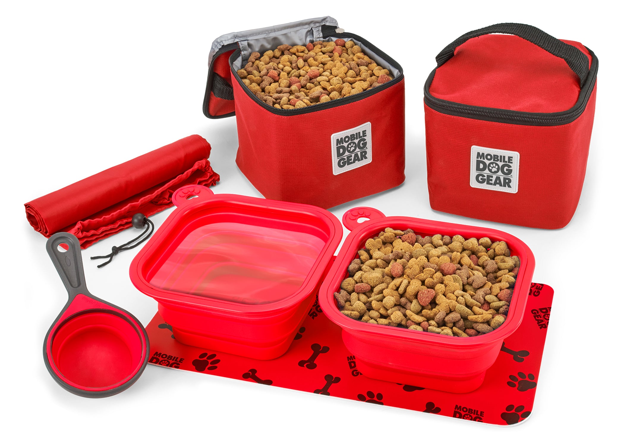 The Dine Away Bag (Med/Lg Dogs)™ features food containers, collapsible bowls, a food scoop, a placemat, and a carrying bag. A dog's photo in a speech bubble declares, "This is my gear!" It's perfectly designed for your adventurous pup's pet luggage.