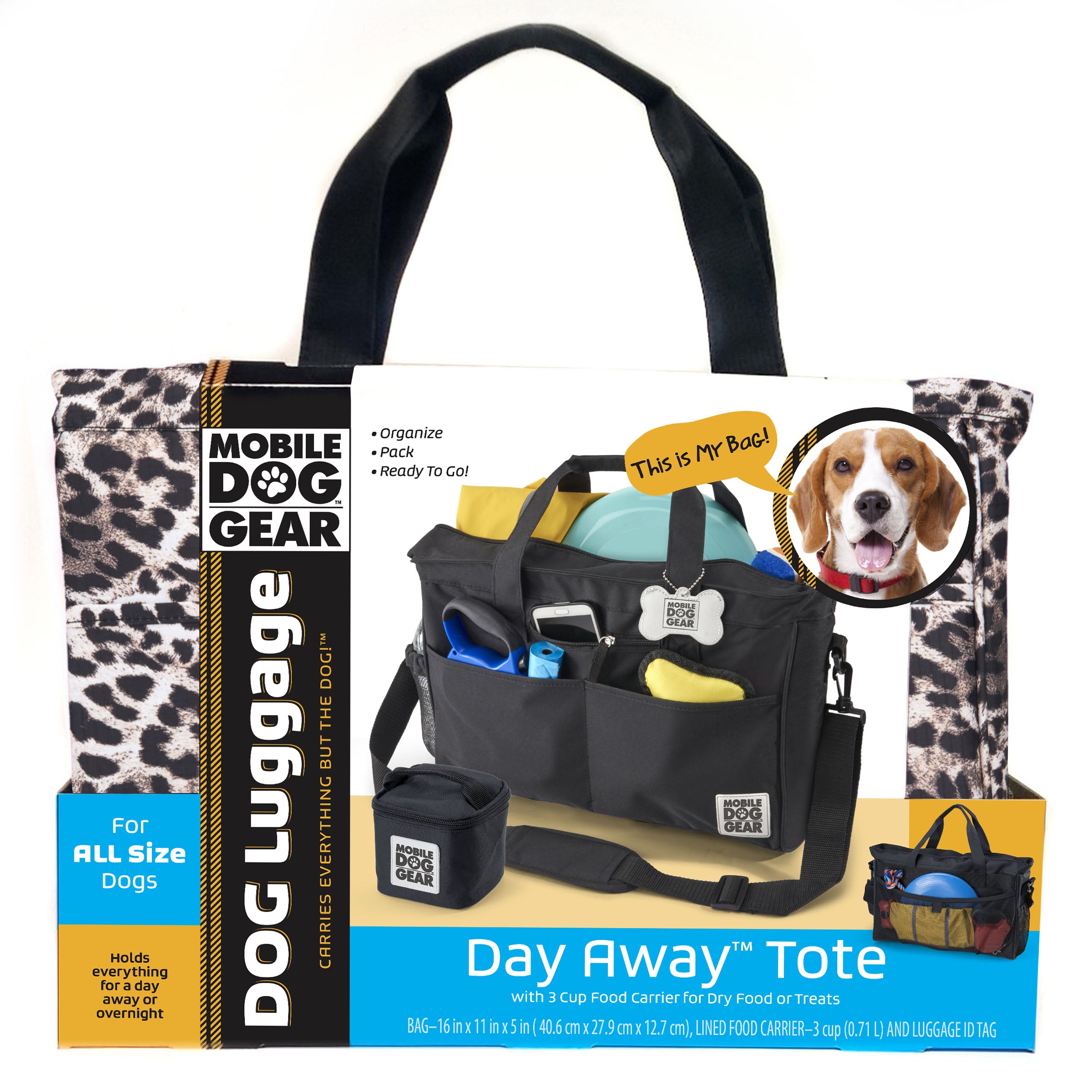 A black Day Away Tote Bag TM packed with various accessories like a phone, frisbee, and towel, accompanied by a small bag of dog food. A speech bubble from a dog image declares, "This is My Bag!" making it the perfect pet luggage for adventures.