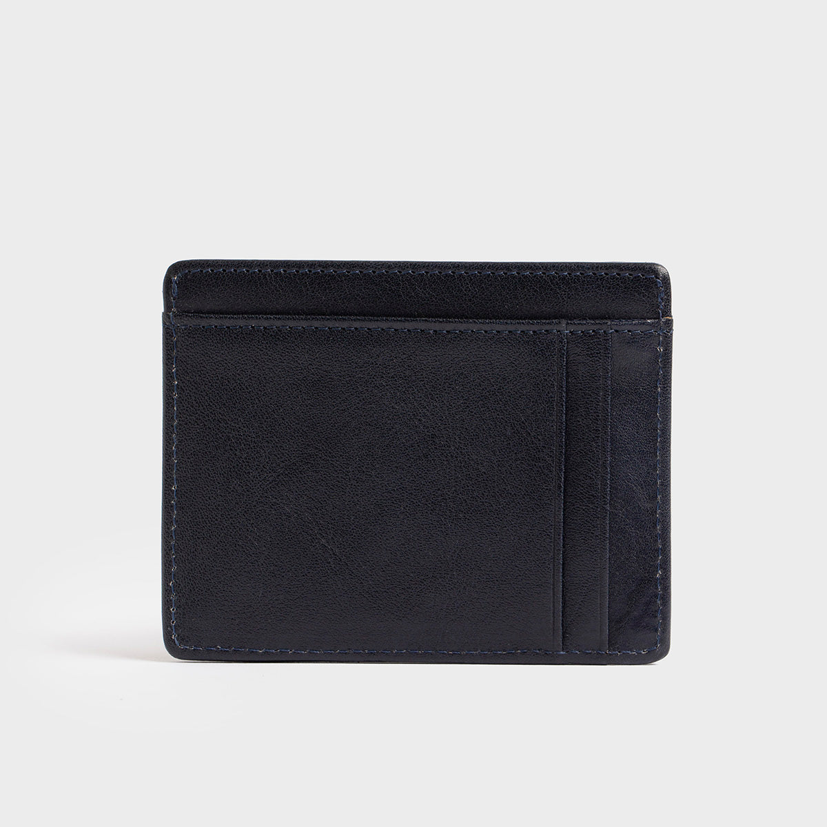 The Belforte - Slim Wallet is a stylish and lightweight black leather card-holder featuring an embossed logo, three card slots, and one easy-access side pocket. Displayed on a plain gray background, it combines elegance with functionality.