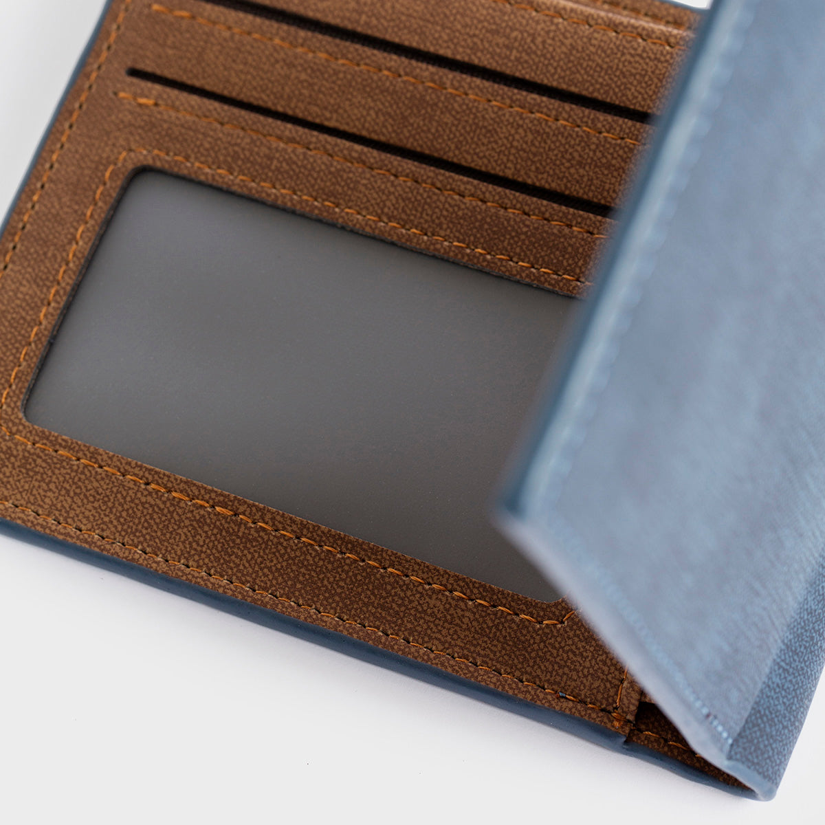 A Clifton - Casual Wallet in blue, featuring a brown patch with the "O/Z" logo on the front, along with convenient inner pockets, presented against a plain white background.