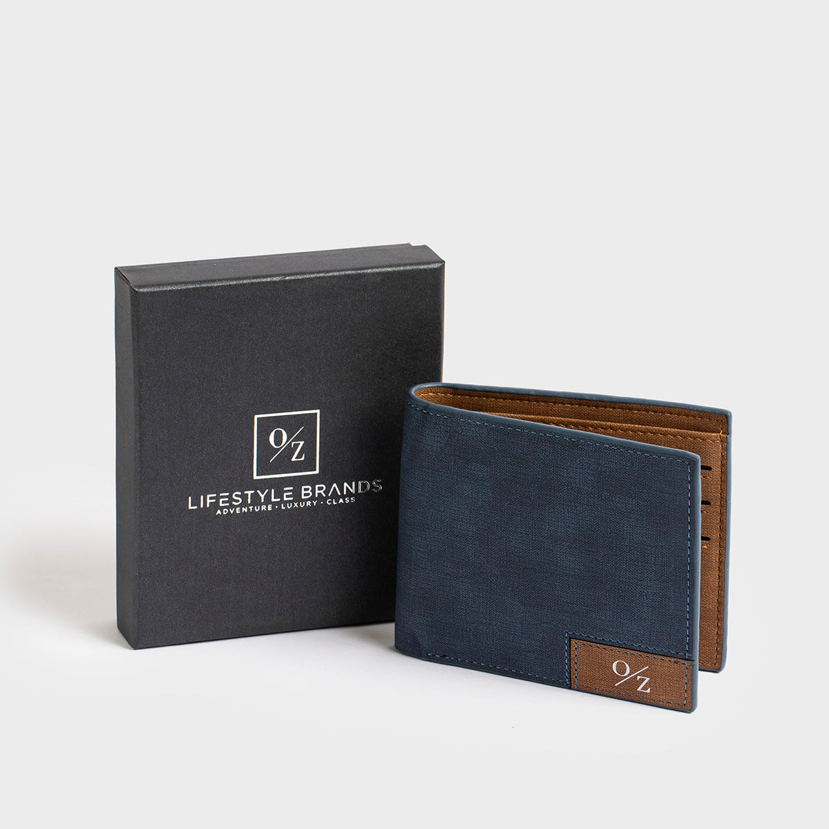 A Clifton - Casual Wallet in blue, featuring a brown patch with the "O/Z" logo on the front, along with convenient inner pockets, presented against a plain white background.