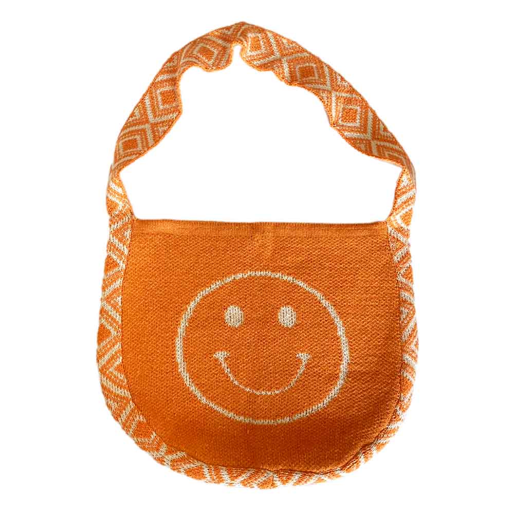 The Poppy Knit Bag boasts a retro-inspired smiley face design in vibrant orange and white, complete with patterned straps for a stylish touch.