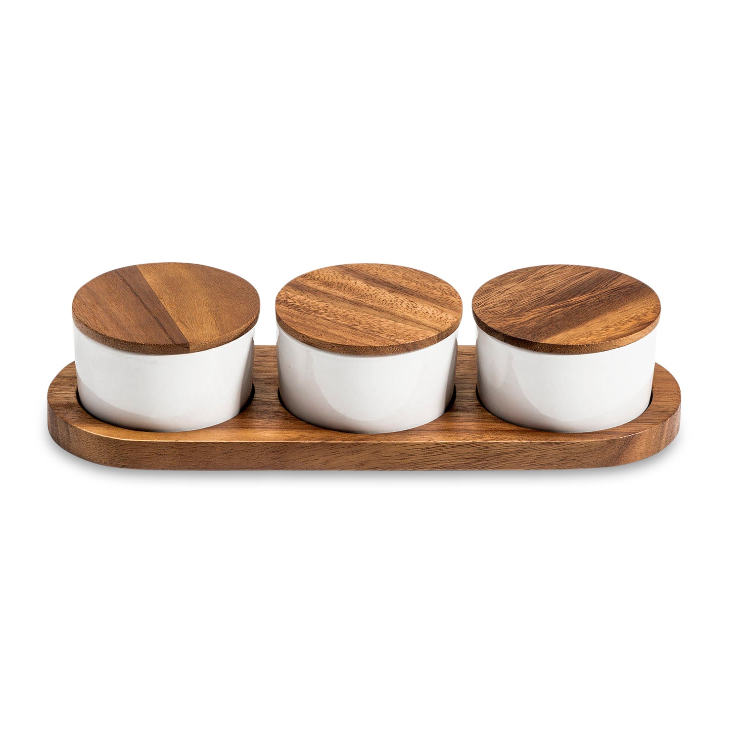 The Condiment Serving Set, featuring three ceramic bowls with wooden lids, is elegantly displayed on an acacia wood tray measuring 13" x 3.75".