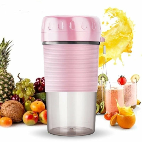 A pink and transparent Portable Personal Juice Blender and Smoothie Maker with a lid featuring a carrying strap, ribbed grip section, and translucent bottom half doubles as a personal wireless juice blender rechargeable via USB.