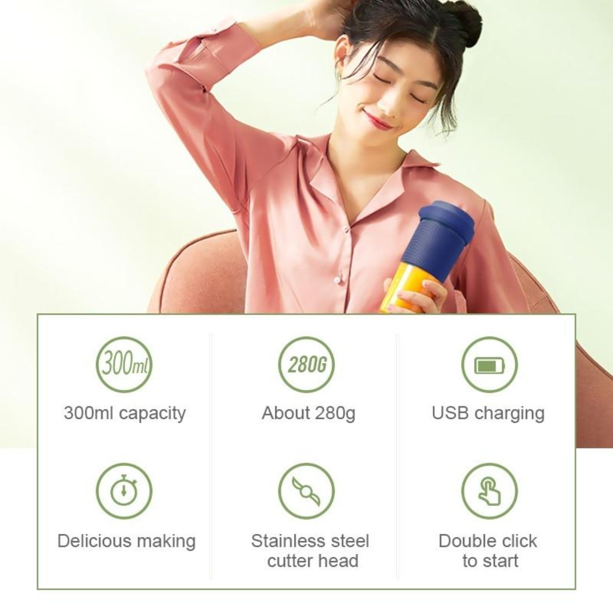 A pink and transparent Portable Personal Juice Blender and Smoothie Maker with a lid featuring a carrying strap, ribbed grip section, and translucent bottom half doubles as a personal wireless juice blender rechargeable via USB.