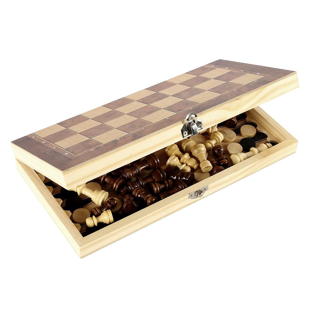 The Foldable Wooden Chess Set Board Game comes with pieces ready for a new match. Extra chess pieces and checkers are also included beneath the portable board.