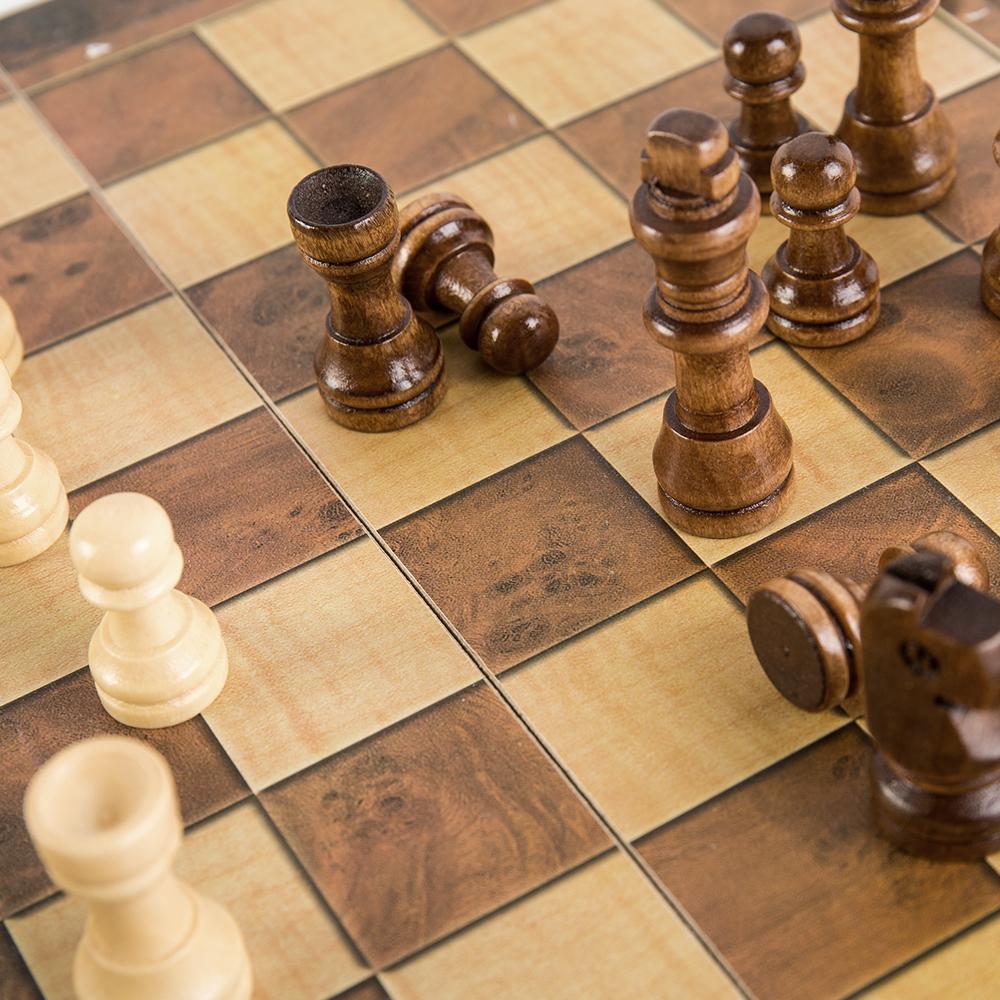 The Foldable Wooden Chess Set Board Game comes with pieces ready for a new match. Extra chess pieces and checkers are also included beneath the portable board.