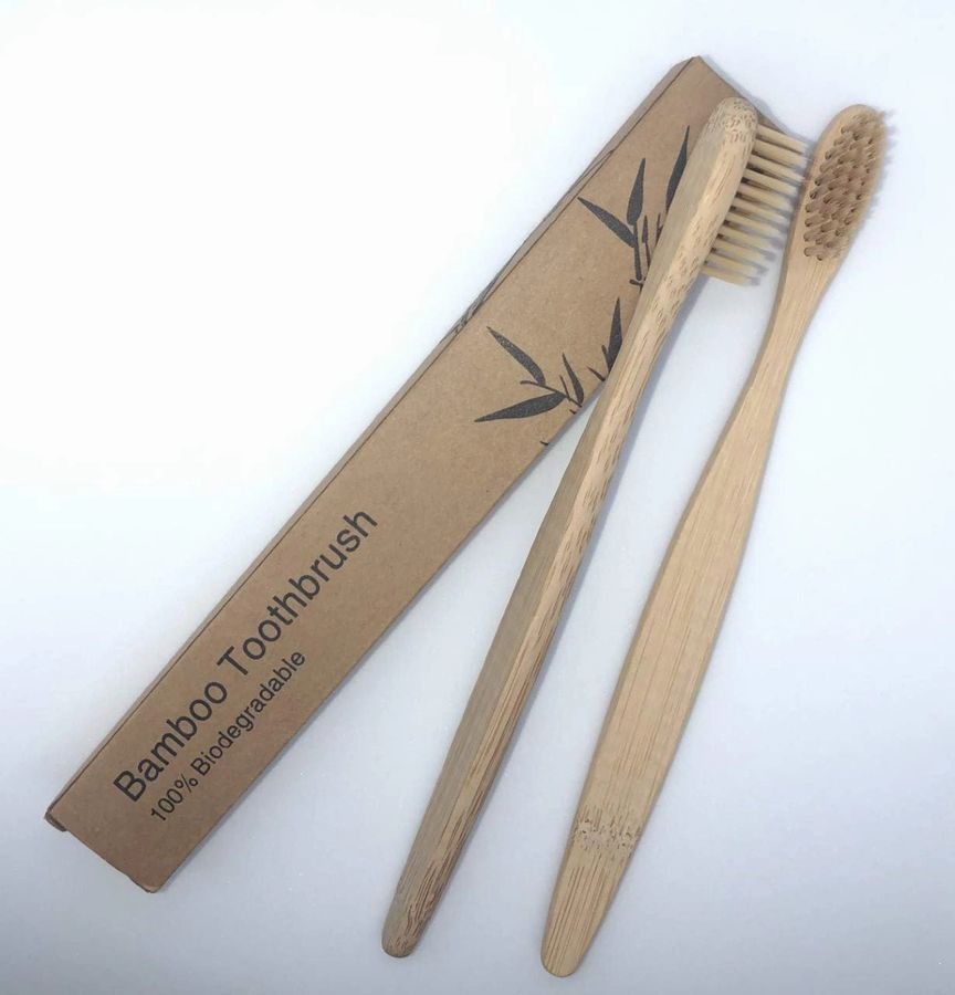 Introducing the Zero-Waste Bath Accessories Bundle, featuring eco-friendly bamboo essentials such as a body brush, comb, soap dish, toothbrush, loofah, and facial brush against a white background.