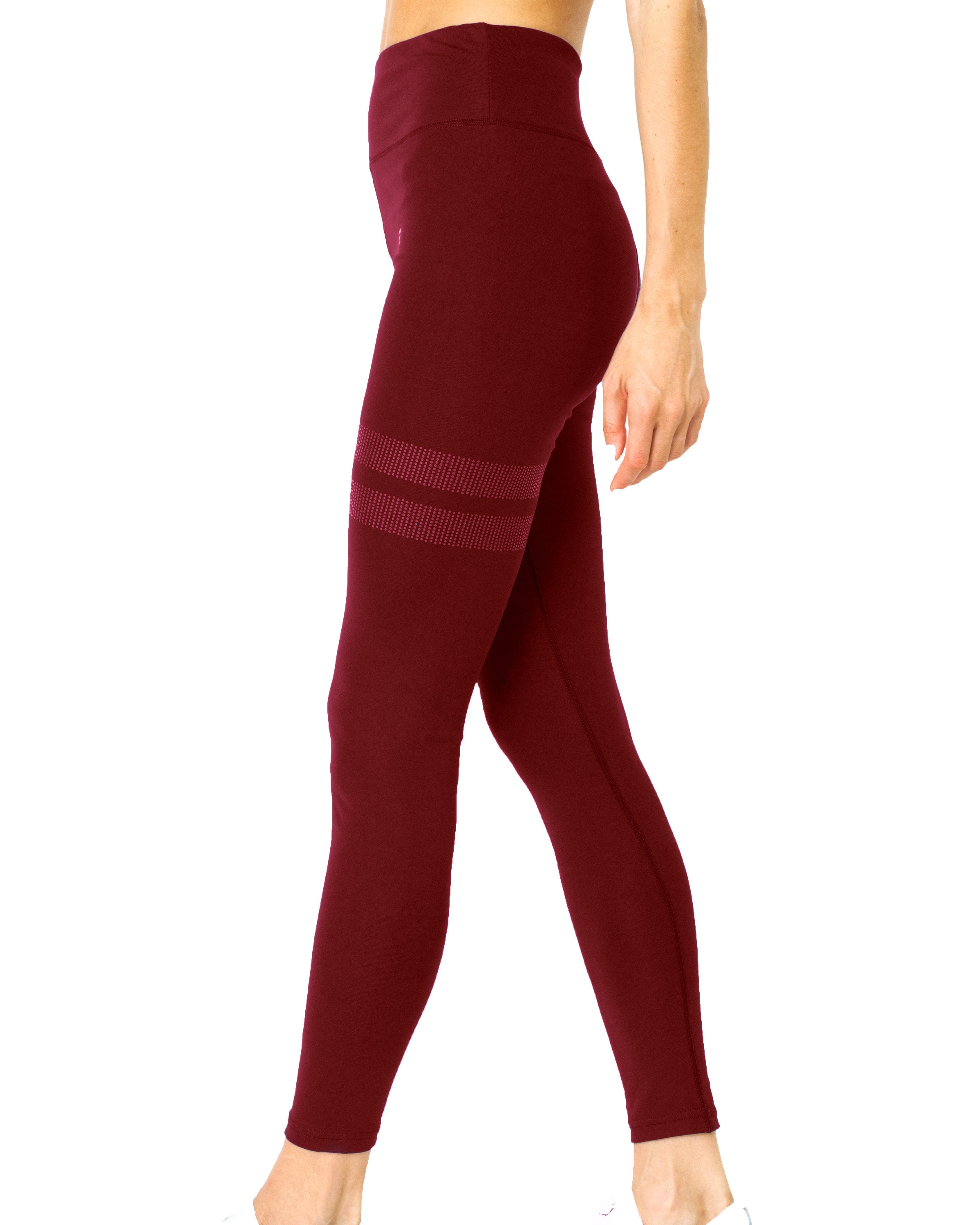 The Ashton Leggings - Maroon, with ribbed detailing and a sculpted compression fit, are ideal for athletic performance. Their sleek side view design combines style and support.