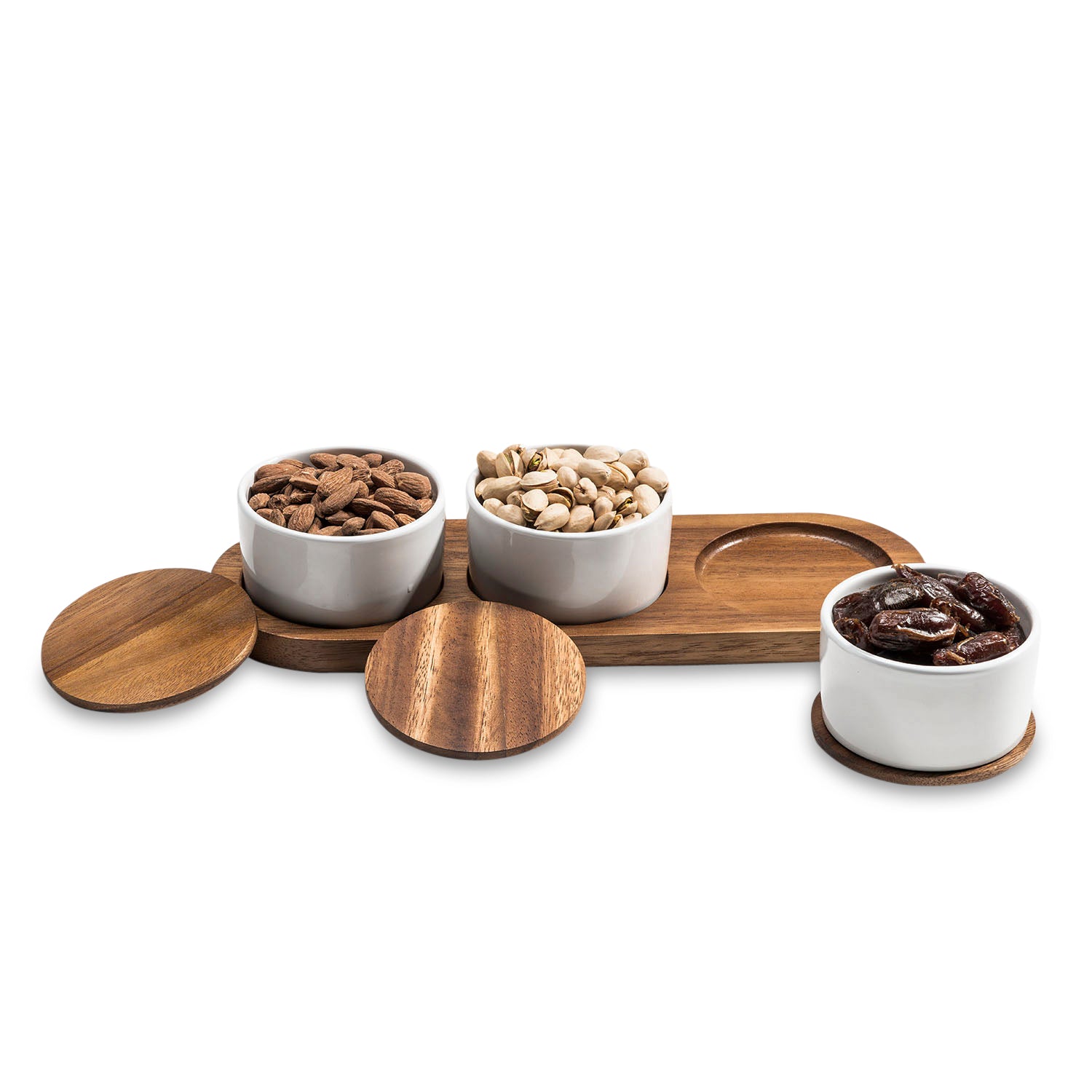 The Condiment Serving Set, featuring three ceramic bowls with wooden lids, is elegantly displayed on an acacia wood tray measuring 13" x 3.75".