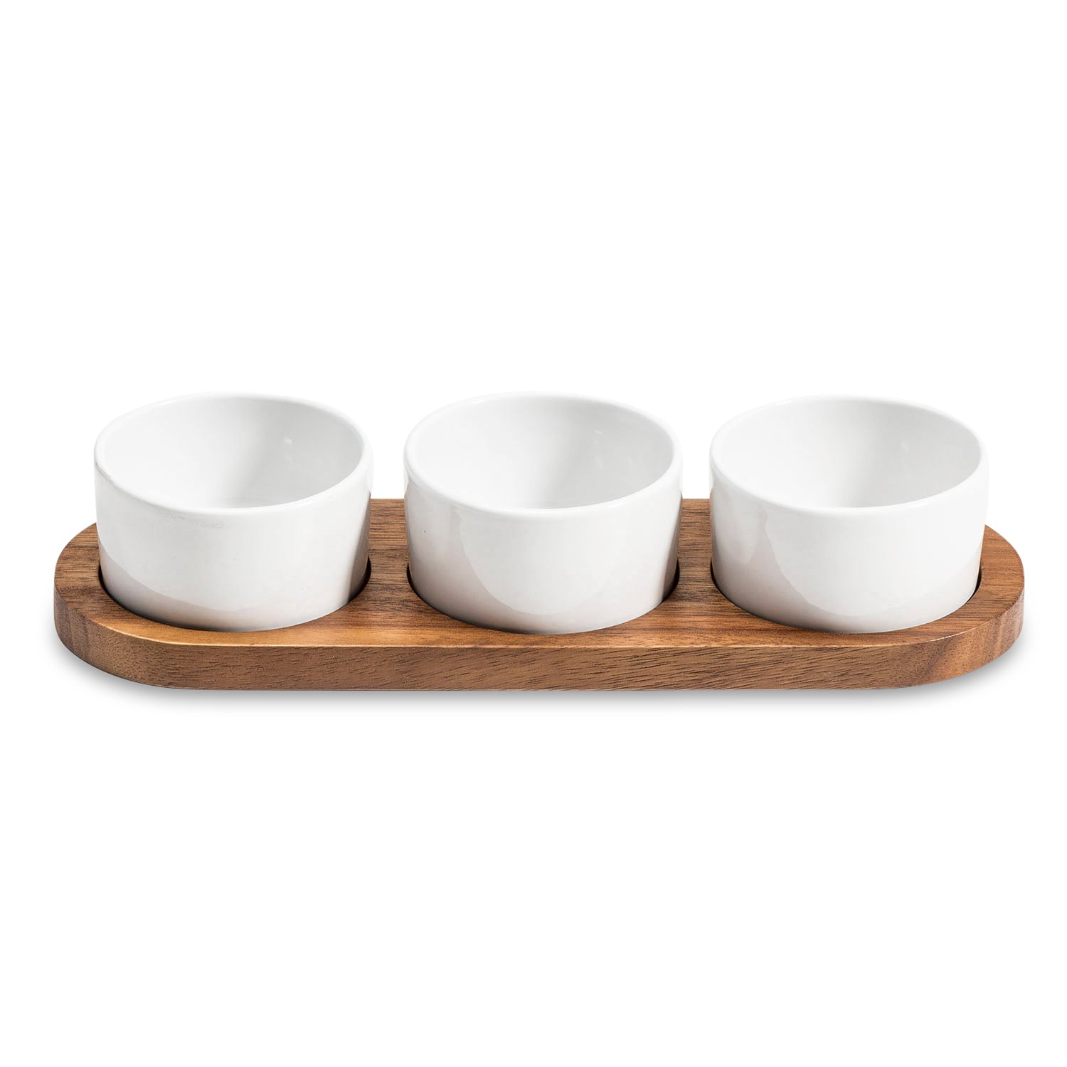 The Condiment Serving Set, featuring three ceramic bowls with wooden lids, is elegantly displayed on an acacia wood tray measuring 13" x 3.75".