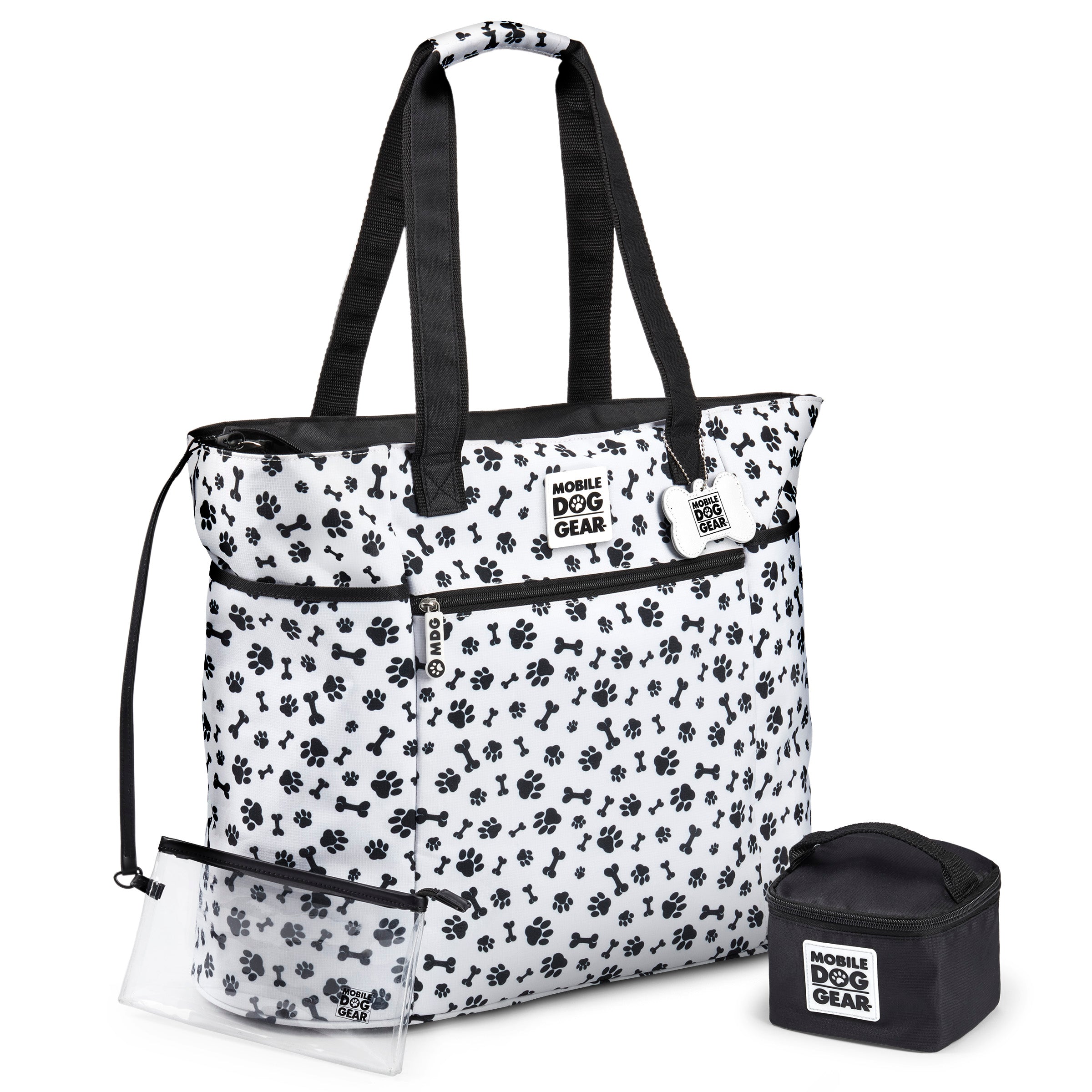 The Mobile Dog Gear Dogssentials Tote Bag features a paw print design, clear pouch, and small accessory bag. Speech bubbles display a dog declaring, "This is MY Bag!" alongside a person exclaiming, "And Mine!" Ideal for stylishly transporting all your dog's essentials.