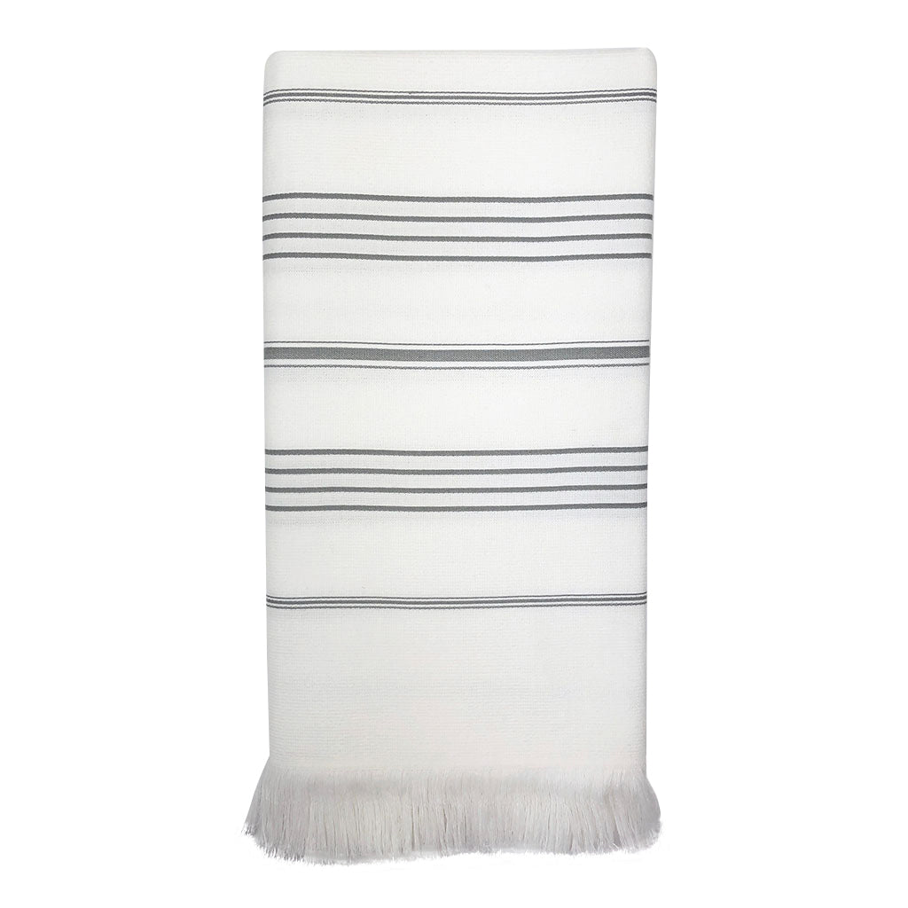 The Classic Terry Turkish Towel is a handmade white towel featuring horizontal gray stripes and fringed edges, ideal for enhancing the elegance of your bath collection.