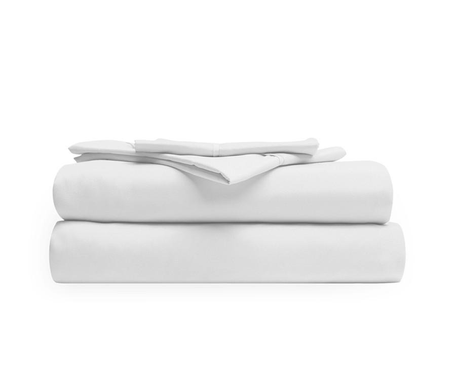 A stack of White microfiber sheets providing luxurious comfort.