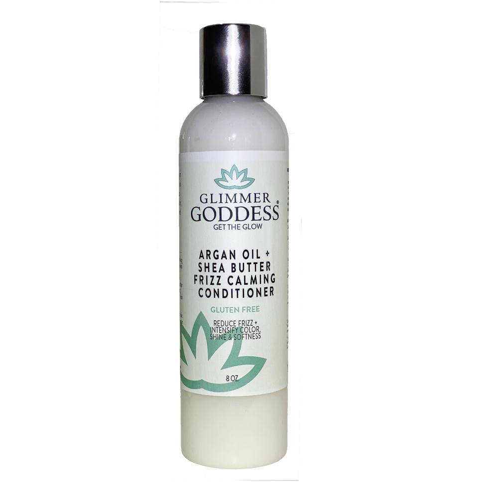 A bottle of Argan Oil Hair & Scalp Conditioner with Shea Butter, labeled for reducing frizz and adding shine to hair.