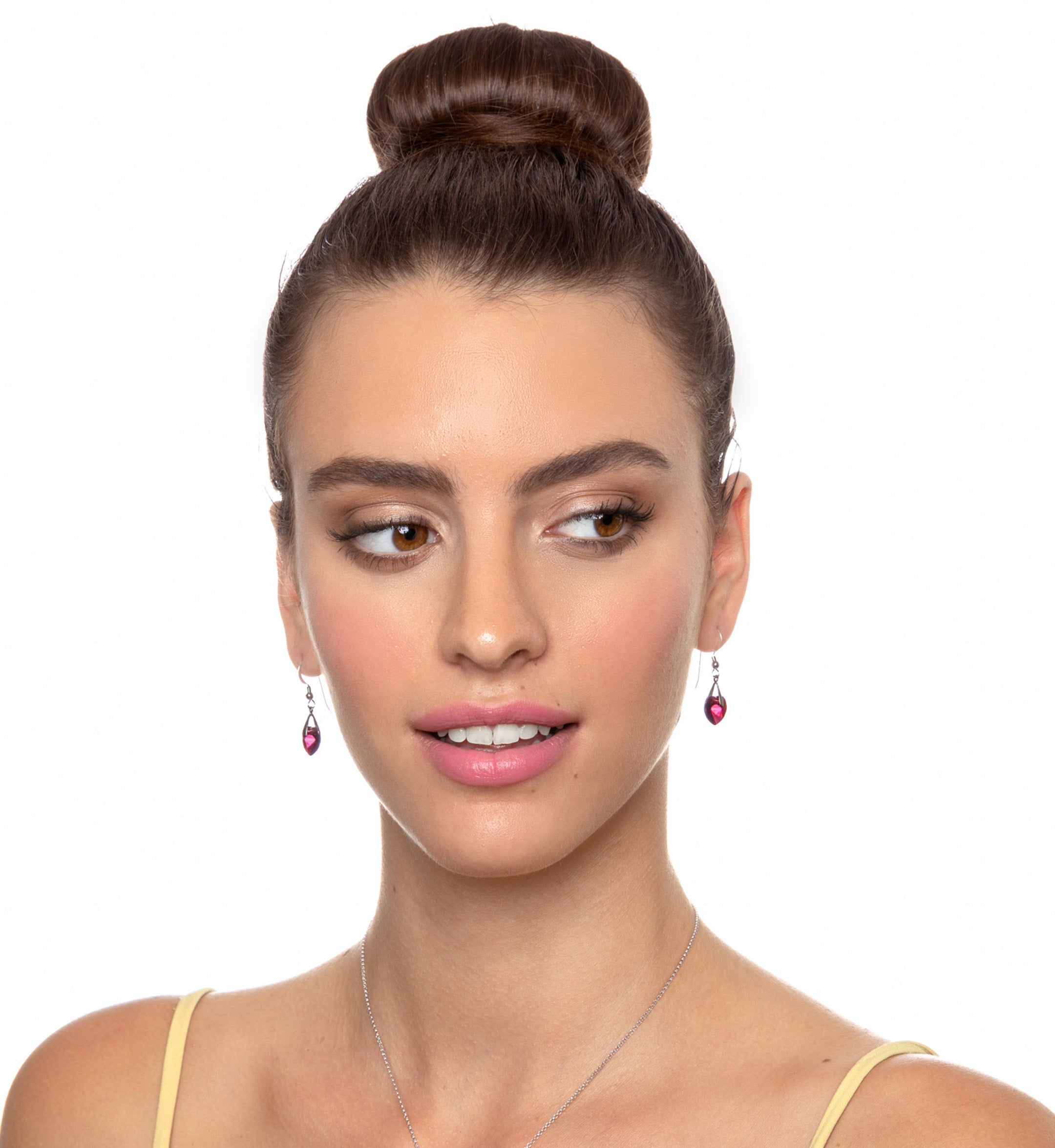 A close-up of a purple Swarovski crystal in a 925 Sterling Silver I Love You Heart Pendant Necklace Set 24k Gold Inscribed in 12 Languages.