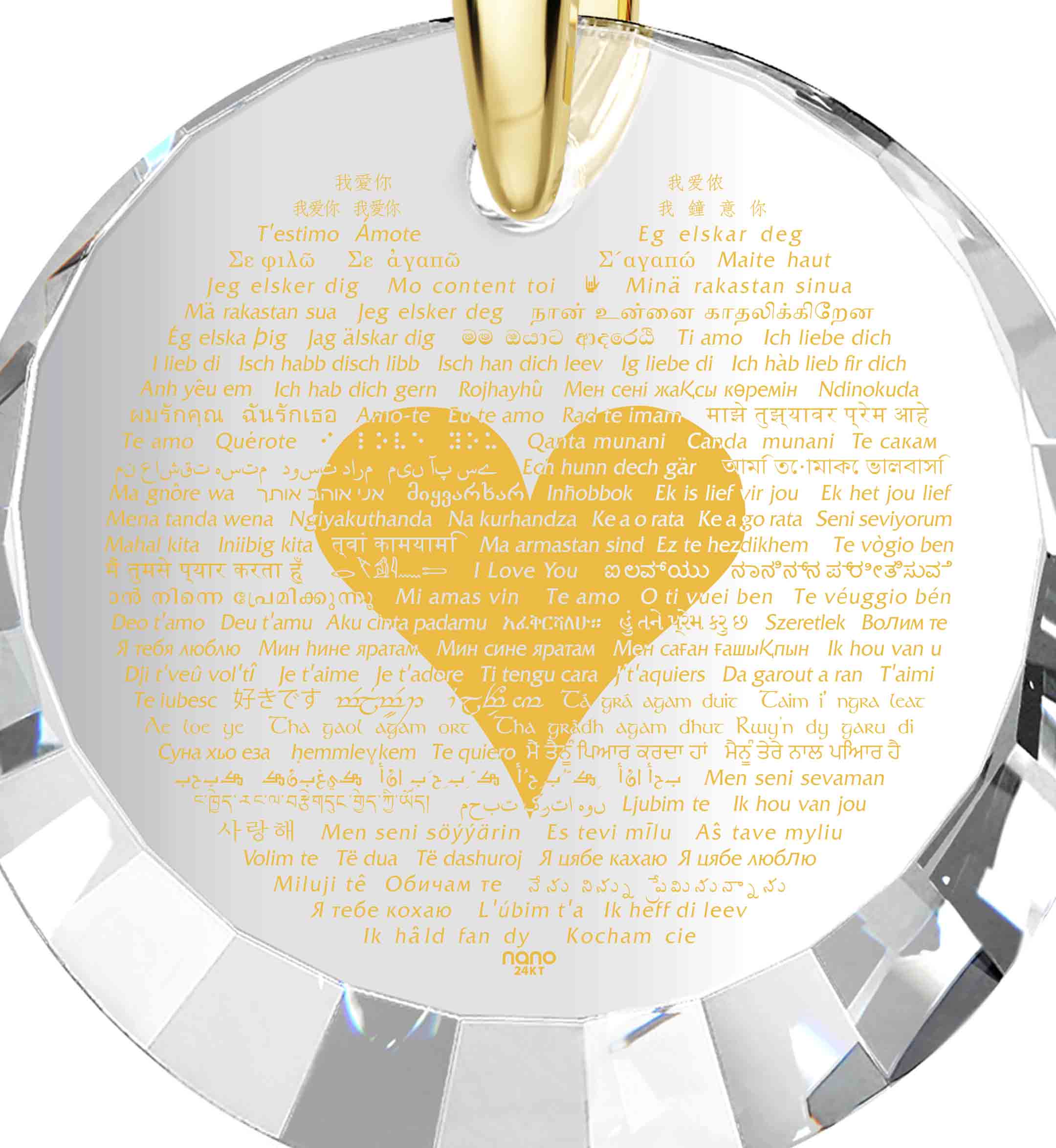 Gold plated silver I Love You necklace with a central label featuring text in various languages, suspended by a golden chain with crystal heart earrings against a starry background.