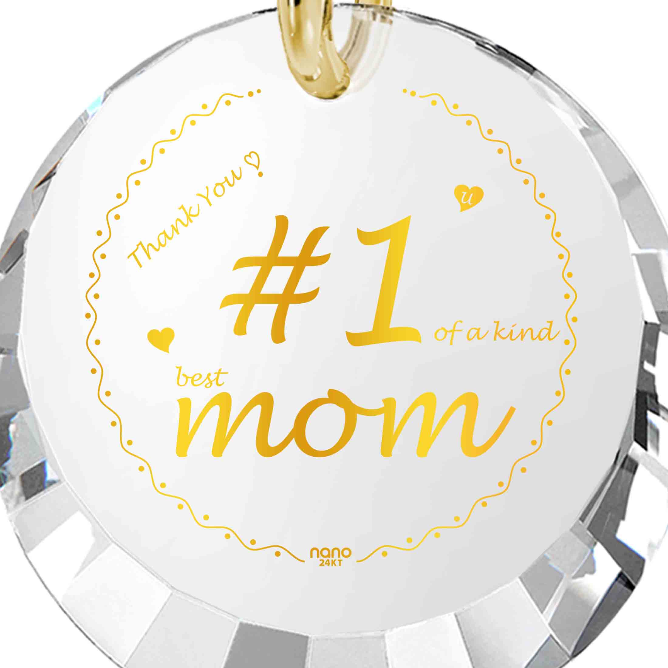 Round pendant with "Number One Mom" in gold script on a black background, encircled by a golden dotted line and decorative hearts, making it a unique gift.