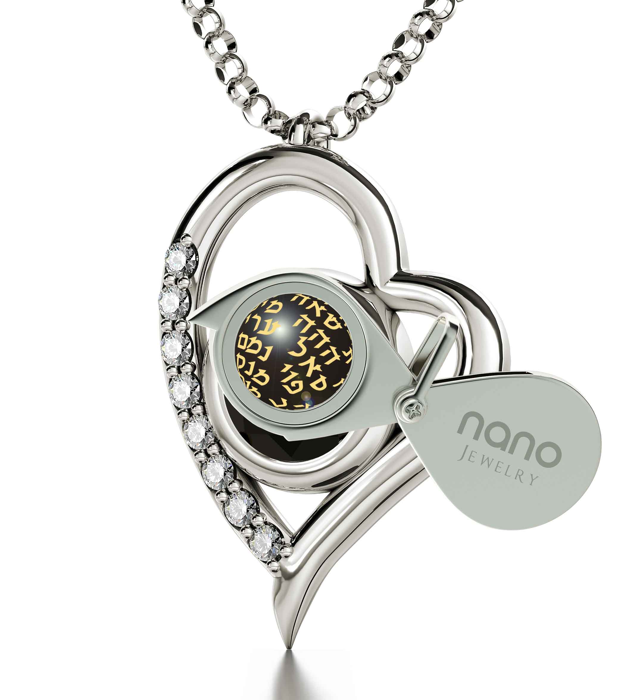 Close-up of a round-cut Swarovski crystal with golden text overlay containing various words, set in a 925 Sterling Silver Kabballah Necklace 72 Names Heart Pendant 24k Gold Inscribed frame.