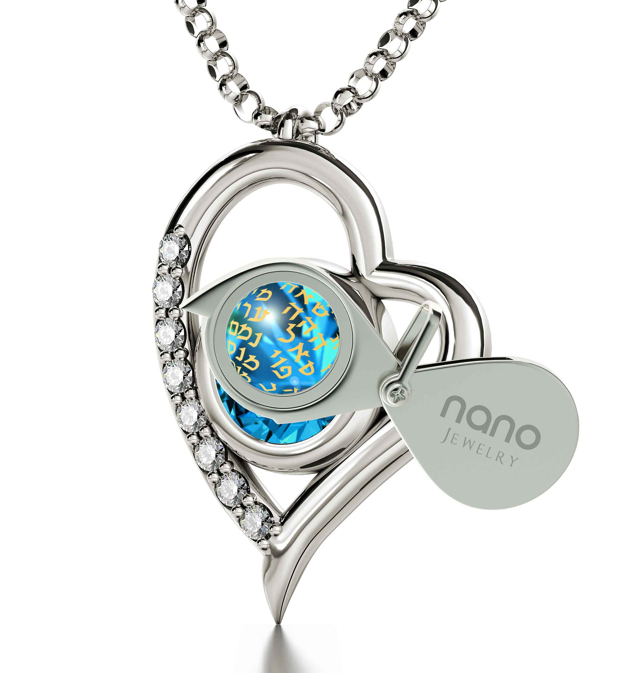 Close-up of a round-cut Swarovski crystal with golden text overlay containing various words, set in a 925 Sterling Silver Kabballah Necklace 72 Names Heart Pendant 24k Gold Inscribed frame.