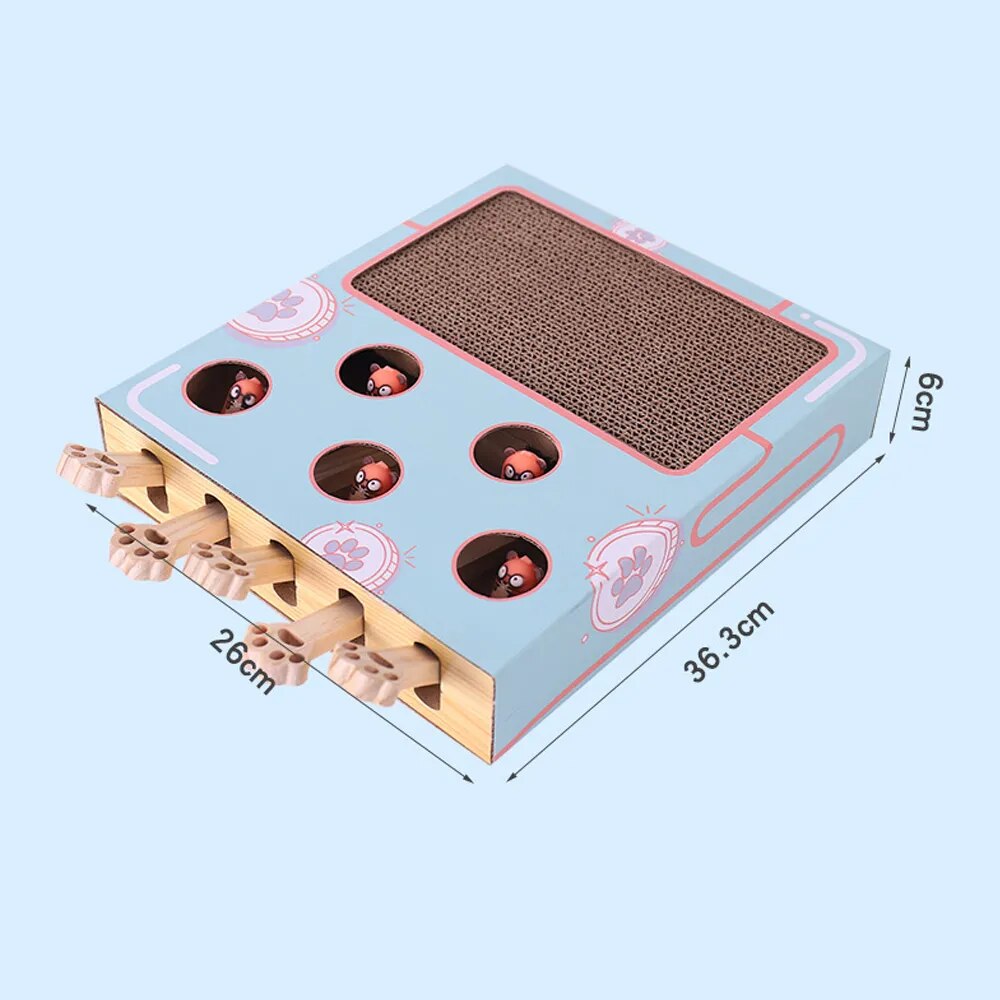 A kitten is sitting on top of a FelinFun Triple Treat Cat Toy, guaranteeing exercise and reducing kitten boredom.