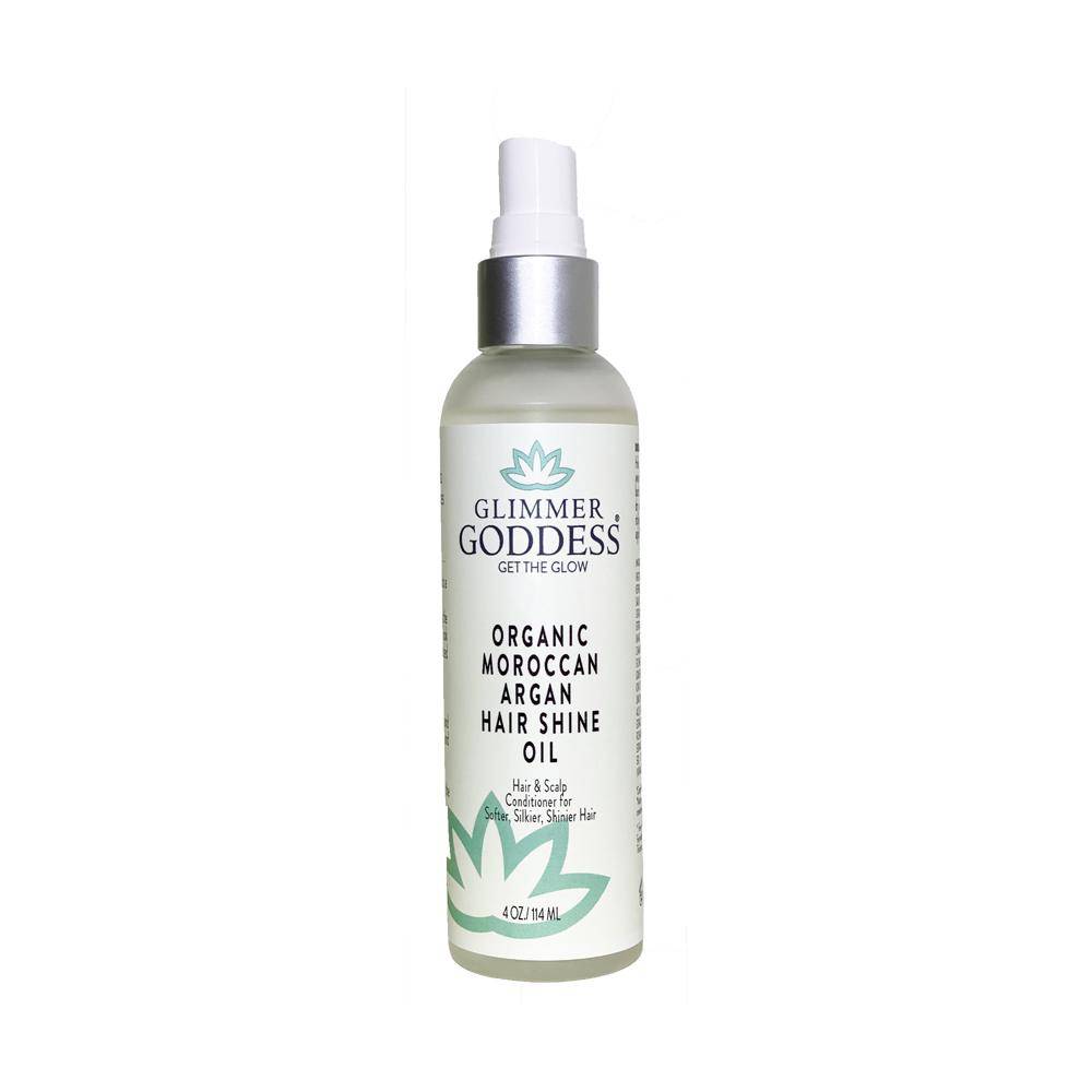 A bottle of Organic Moroccan Argan Oil Hair Shine Spray, labeled as a vegan and sulfate-free product.
