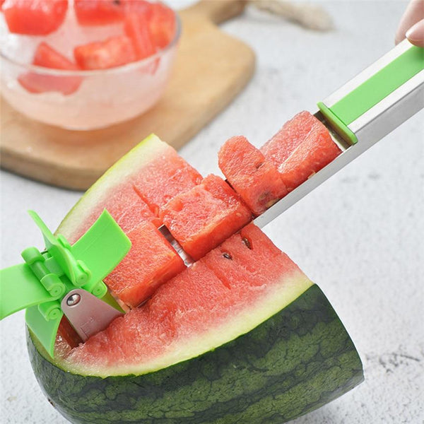 A person cutting a Windmill Watermelon Slicer.