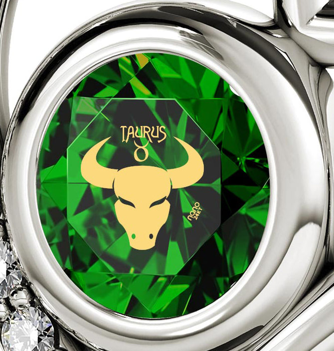 Close-up of a 925 Sterling Silver Taurus Necklace Zodiac Heart Pendant 24k Gold Inscribed on Crystal depicted in gold on a green geometric background, set in a silver ring encrusted with diamonds and featuring Taurus zodiac jewelry elements.