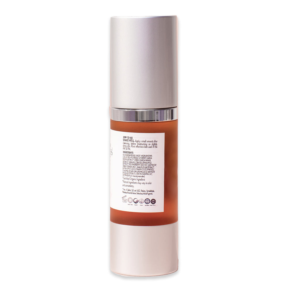 A bottle of Organic DMAE + Alpha Lipoic Skin Firming Serum, enhanced with skin tightening DMAE, features a white and silver pump, labeled with pink and orange details.