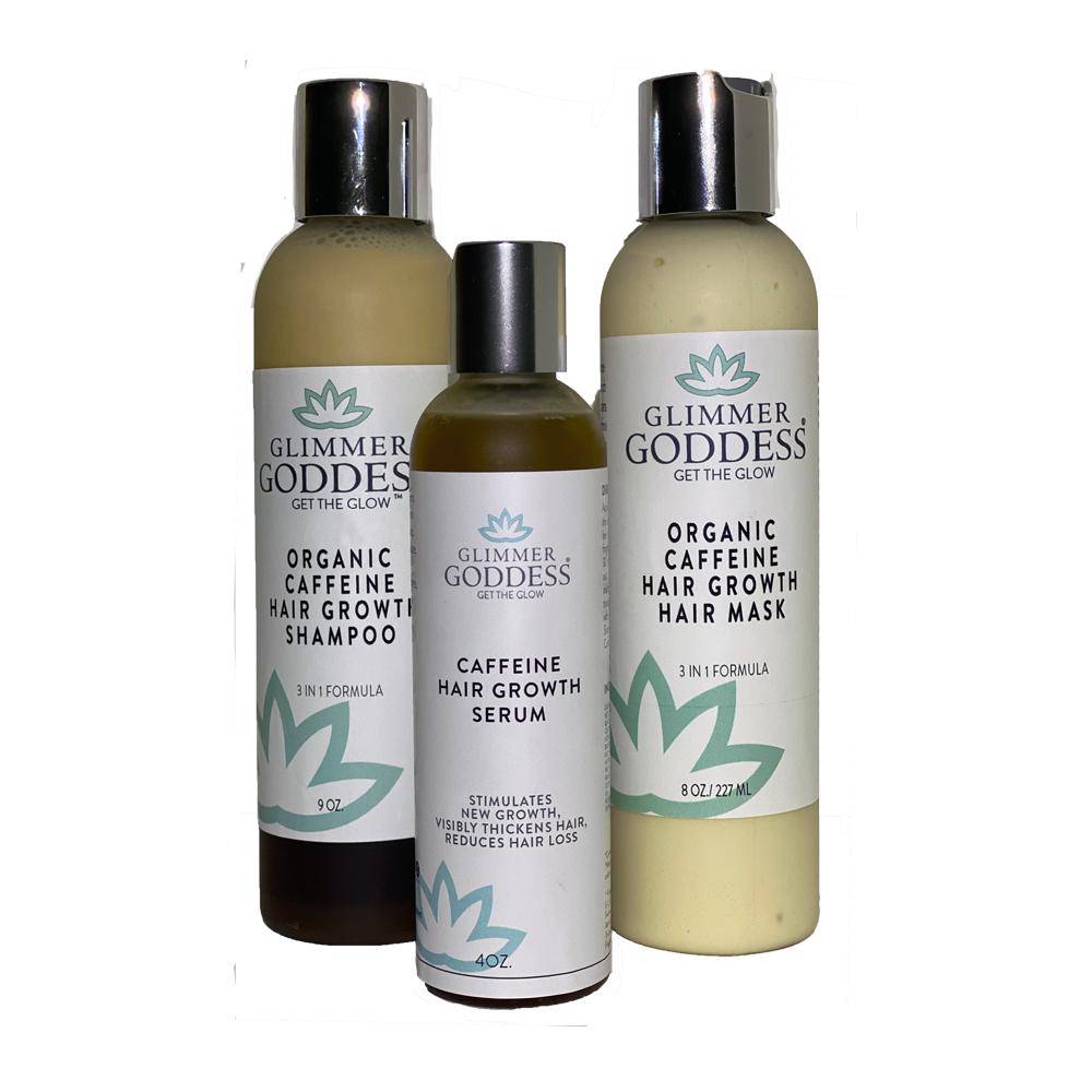 Three bottles of Organic Caffeine Hair Growth Trio: a shampoo, a hair serum, and a hair mask, all labeled organic and caffeine-infused, suitable for color treated hair.