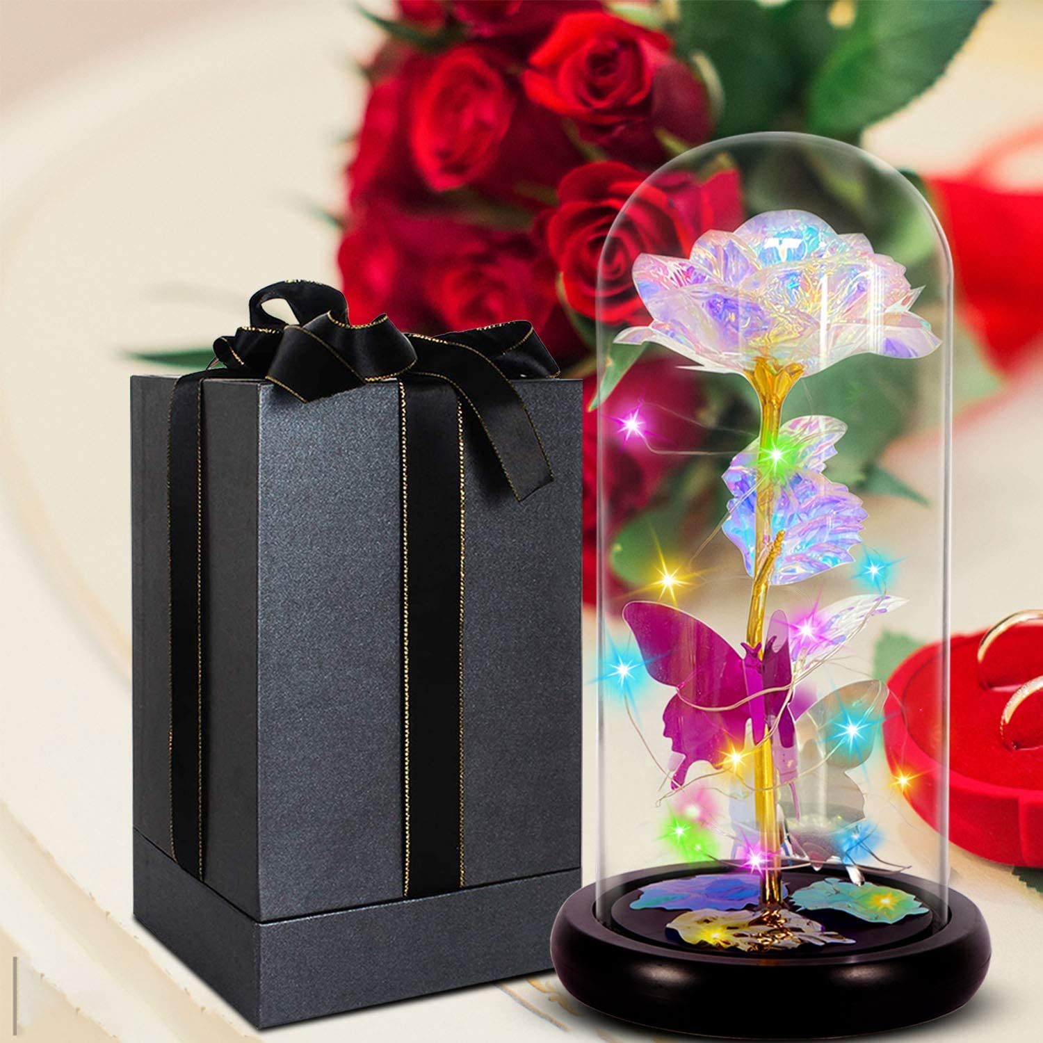 A ModernMazing Valentines Day Gifts for Her Rose Gifts,Love Flower Galaxy Rose with Led Decor in Glass Dome Valentines Gifts,Unique Gifts for Her next to a gift box.