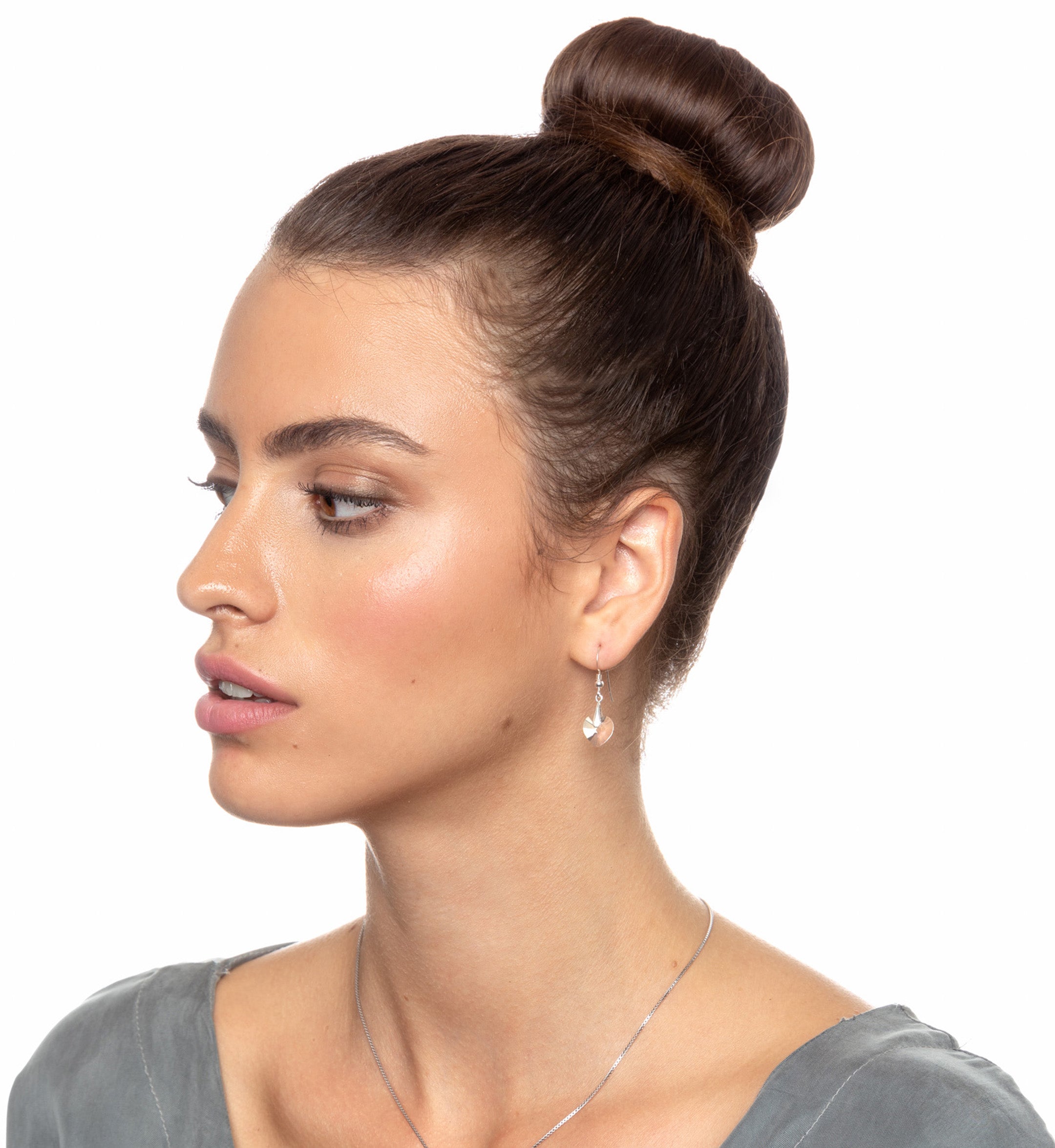 A close-up of a purple Swarovski crystal in a 925 Sterling Silver I Love You Heart Pendant Necklace Set 24k Gold Inscribed in 12 Languages.