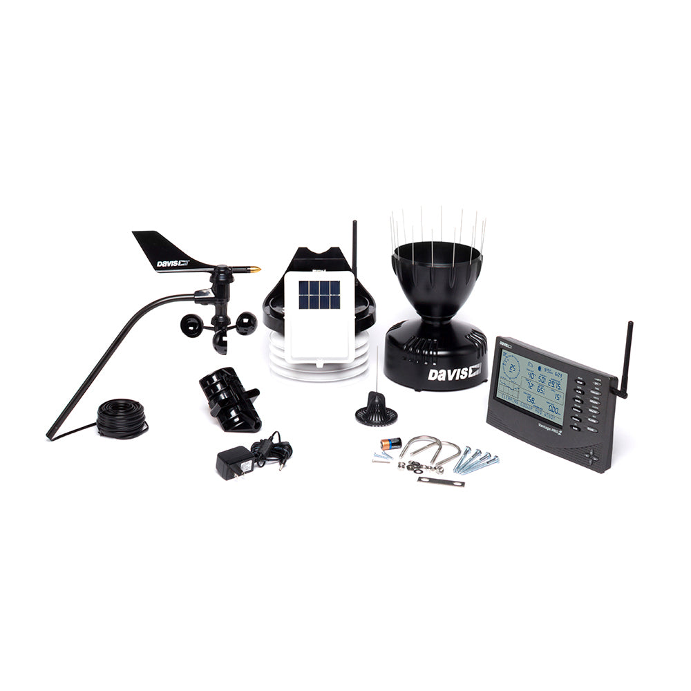 A black and white image of a Davis Vantage Pro2™ Wireless Weather Station by Davis Instruments and other items.