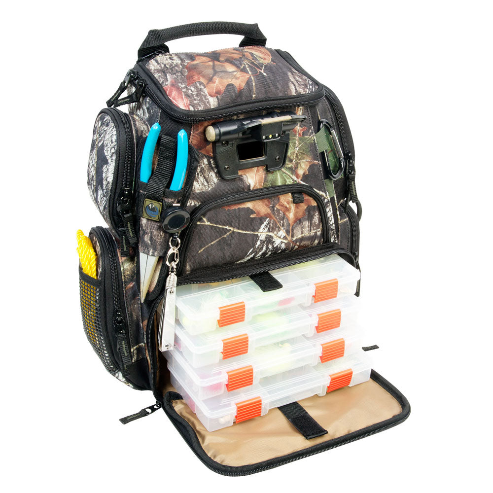 A Wild River RECON Mossy Oak Compact Lighted Backpack w-4 PT3500 Trays with a lot of fishing equipment in it.